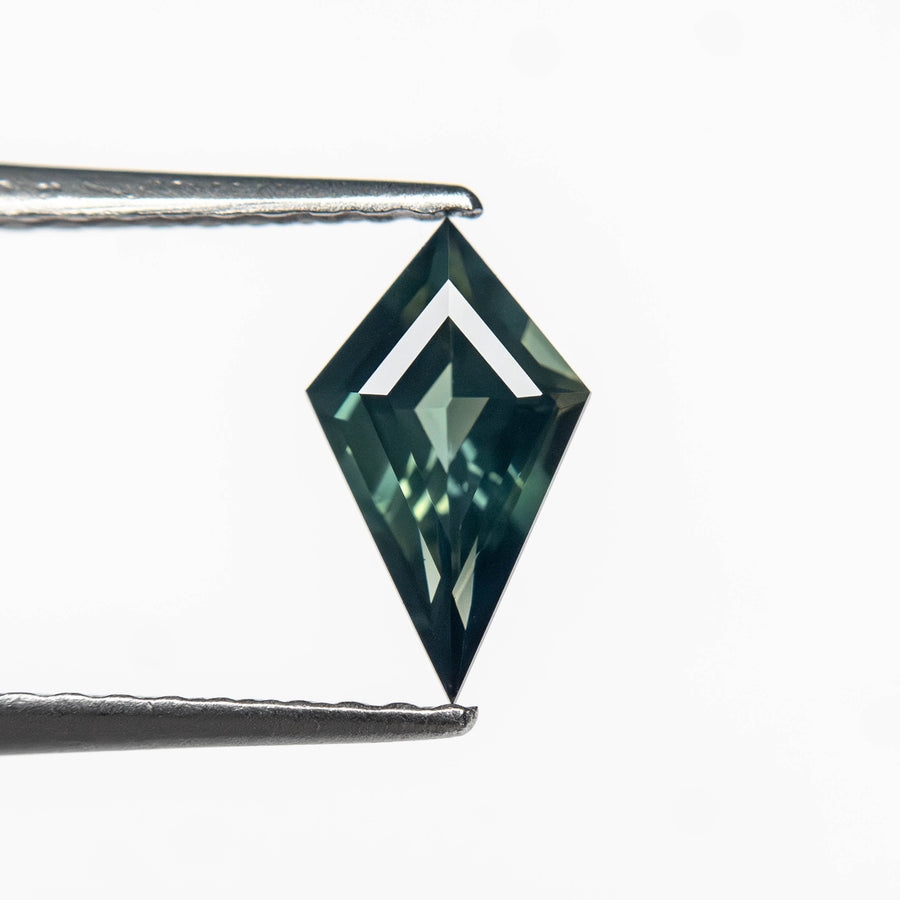 The 0.58ct 8.45x4.89x2.73mm Kite Step Cut Sapphire 27363-18 by East London jeweller Rachel Boston | Discover our collections of unique and timeless engagement rings, wedding rings, and modern fine jewellery. - Rachel Boston Jewellery