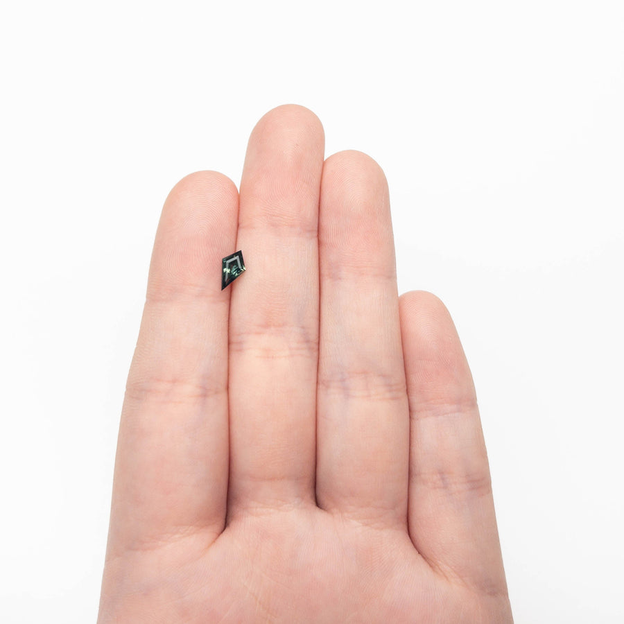 The 0.58ct 8.45x4.89x2.73mm Kite Step Cut Sapphire 27363-18 by East London jeweller Rachel Boston | Discover our collections of unique and timeless engagement rings, wedding rings, and modern fine jewellery. - Rachel Boston Jewellery