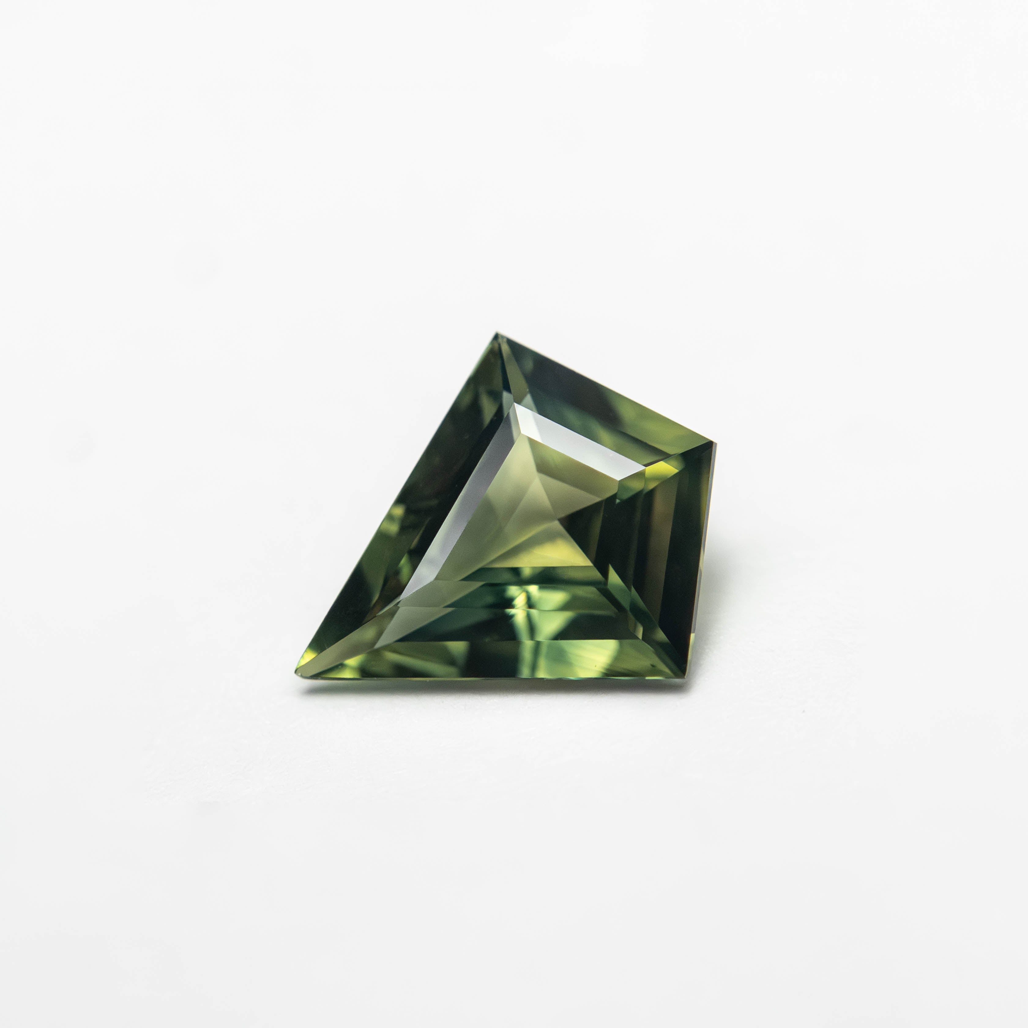 The 0.85ct 8.47x7.22x2.84mm Kite Step Cut Sapphire 27363-19 by East London jeweller Rachel Boston | Discover our collections of unique and timeless engagement rings, wedding rings, and modern fine jewellery.