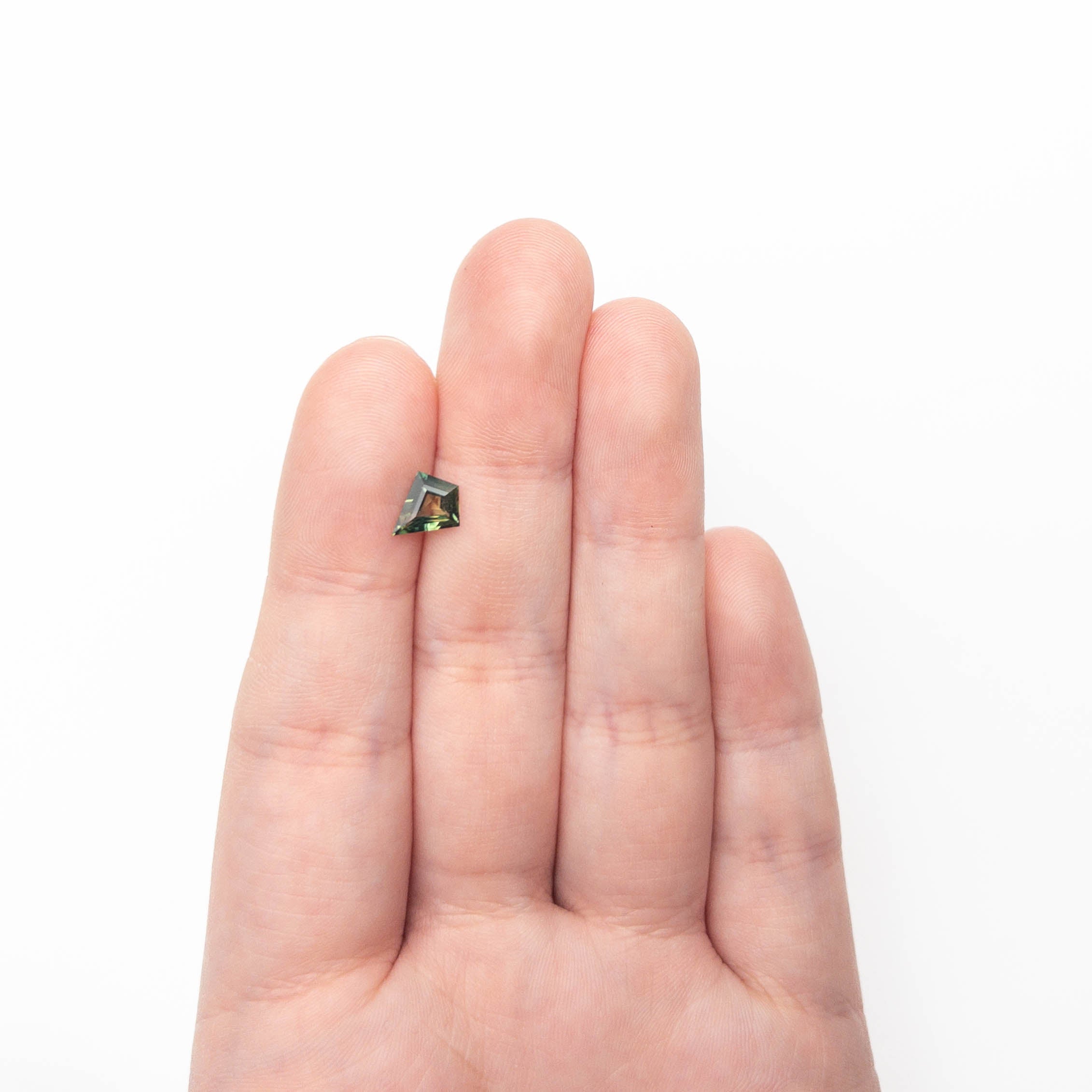 The 0.85ct 8.47x7.22x2.84mm Kite Step Cut Sapphire 27363-19 by East London jeweller Rachel Boston | Discover our collections of unique and timeless engagement rings, wedding rings, and modern fine jewellery.