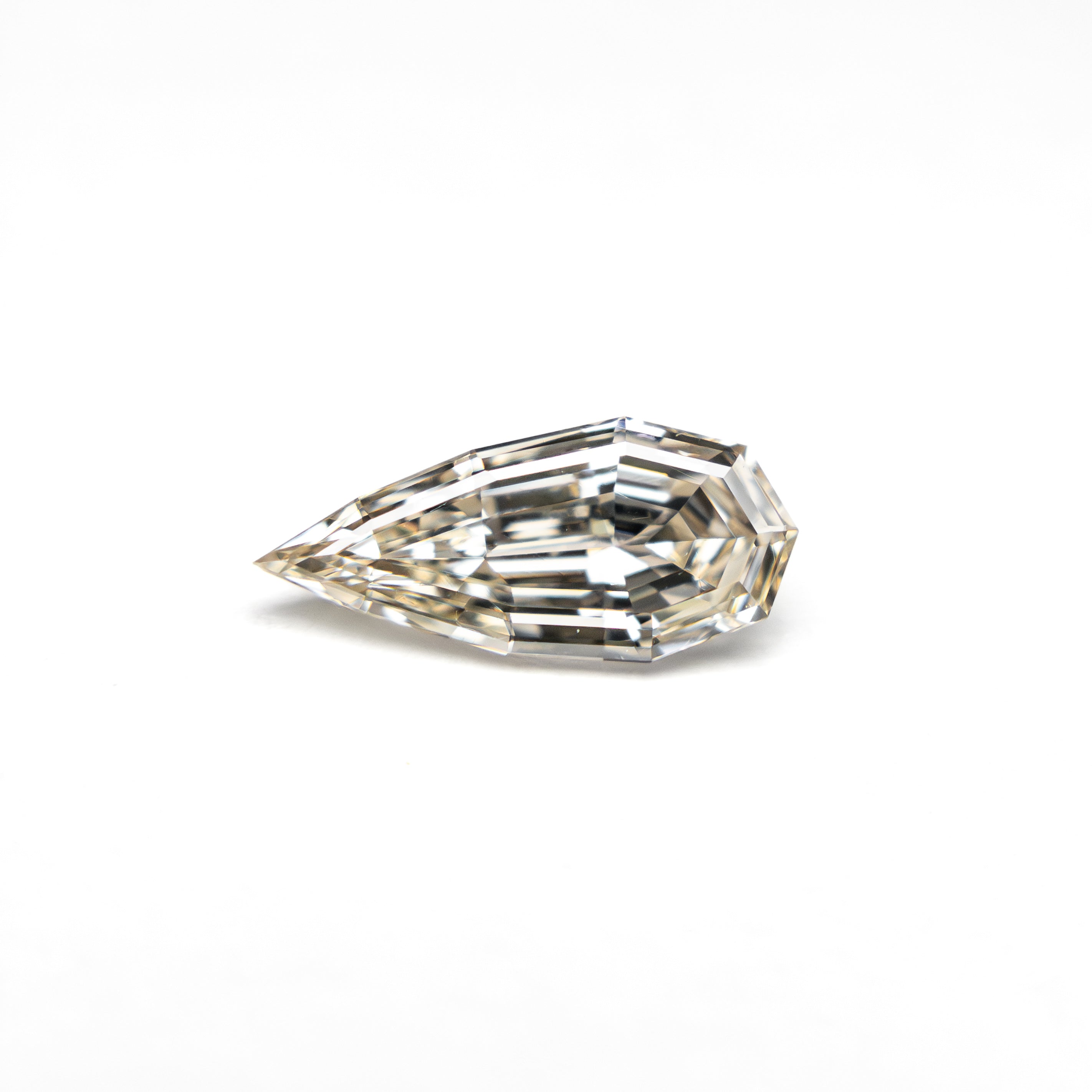 The 0.50ct 8.58x3.88x2.35mm SI1 W-X Geo Pear Step Cut 🇿🇦 27364-18 by East London jeweller Rachel Boston | Discover our collections of unique and timeless engagement rings, wedding rings, and modern fine jewellery.
