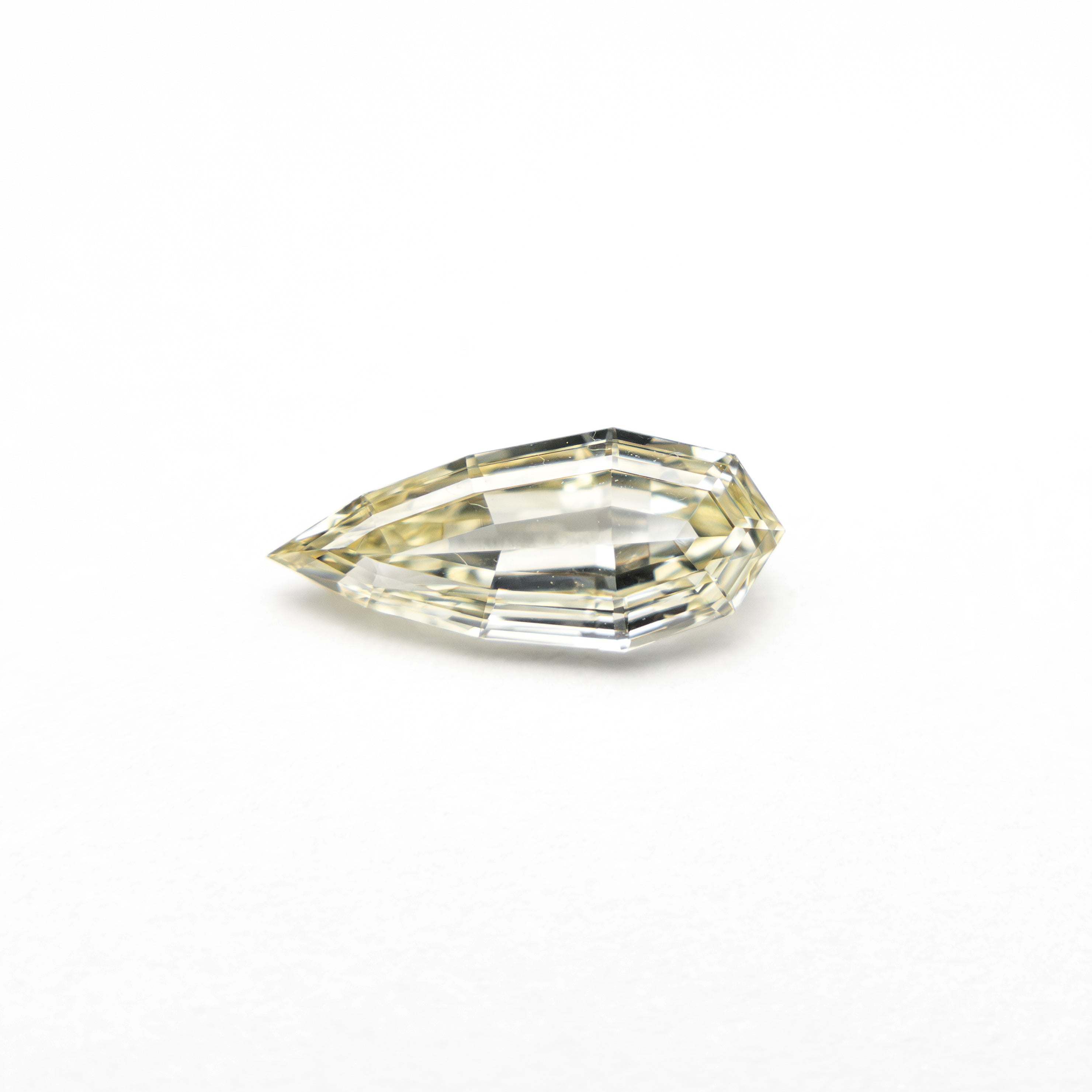The 0.48ct 8.66x3.70x2.10mm VS2 C3 Geo Pear Step Cut 🇿🇦 27364-20 by East London jeweller Rachel Boston | Discover our collections of unique and timeless engagement rings, wedding rings, and modern fine jewellery.