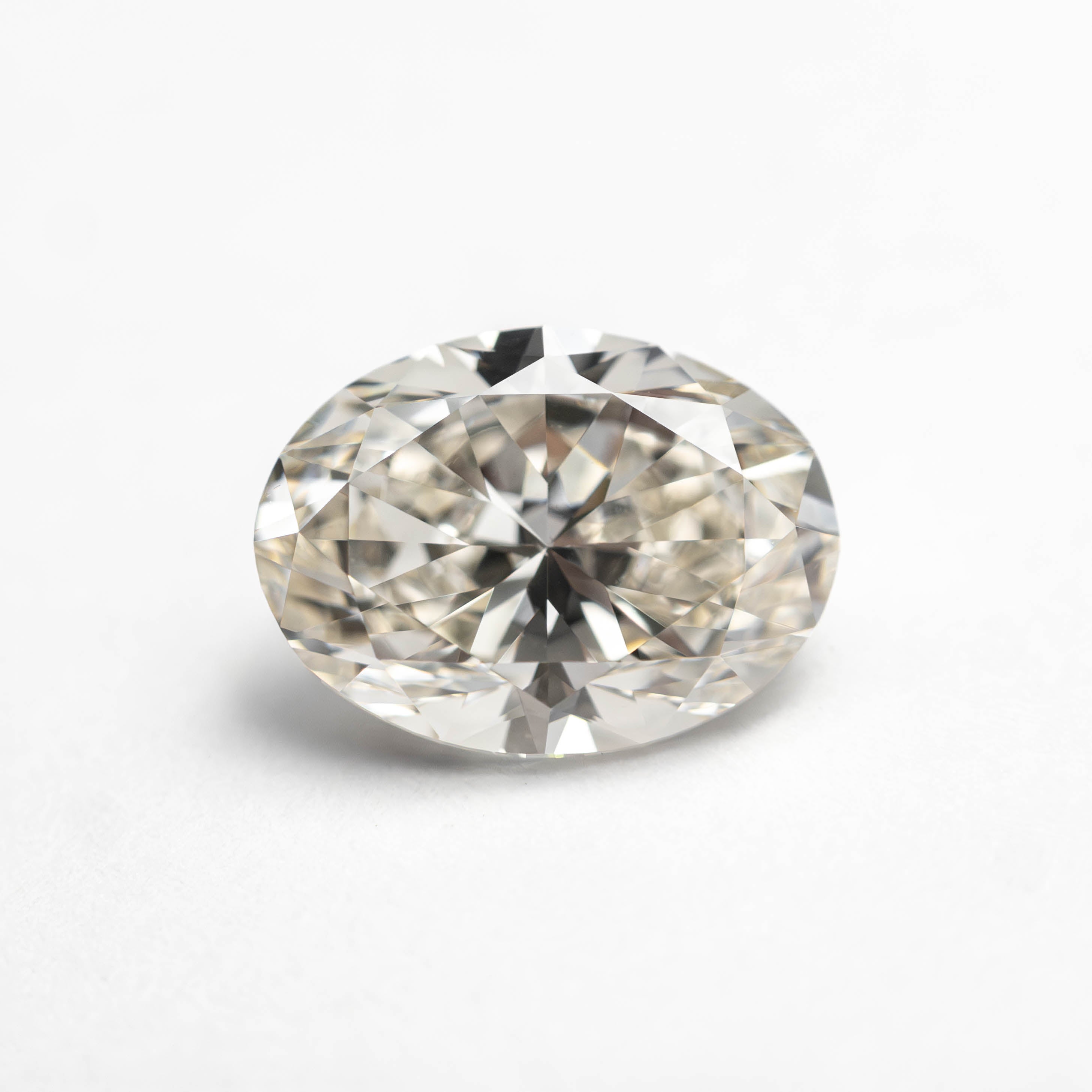 The 1.50ct 8.46x6.25x4.17mm VS2 K Oval Brilliant 27386-01 by East London jeweller Rachel Boston | Discover our collections of unique and timeless engagement rings, wedding rings, and modern fine jewellery.