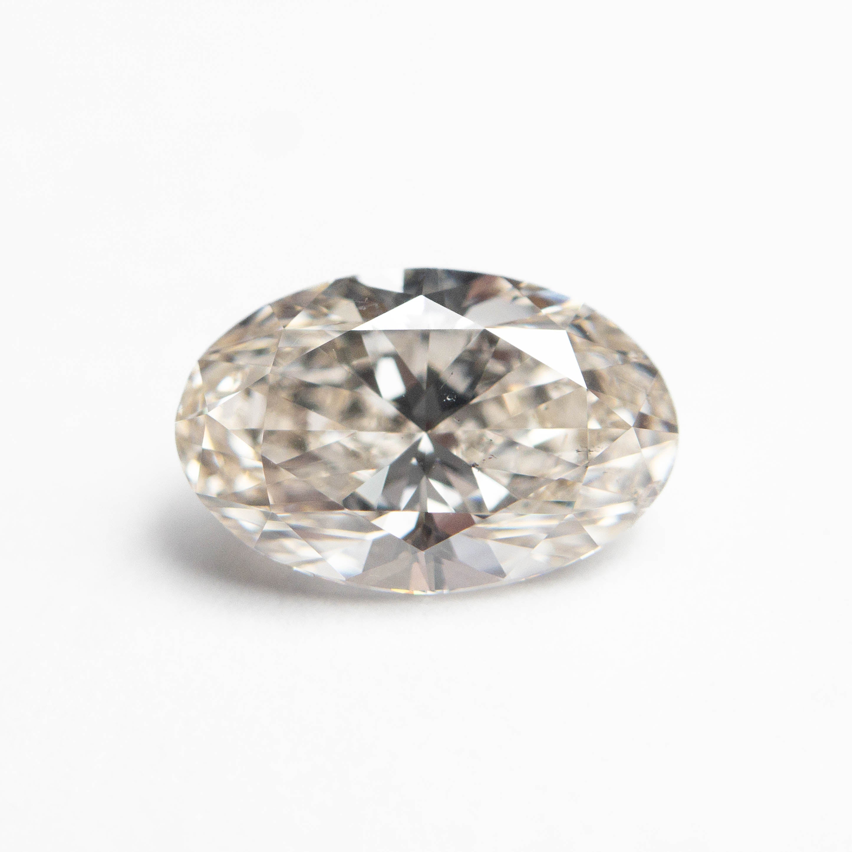 The 1.50ct 9.27x6.07x3.96mm SI2 K Oval Brilliant 27386-02 by East London jeweller Rachel Boston | Discover our collections of unique and timeless engagement rings, wedding rings, and modern fine jewellery.