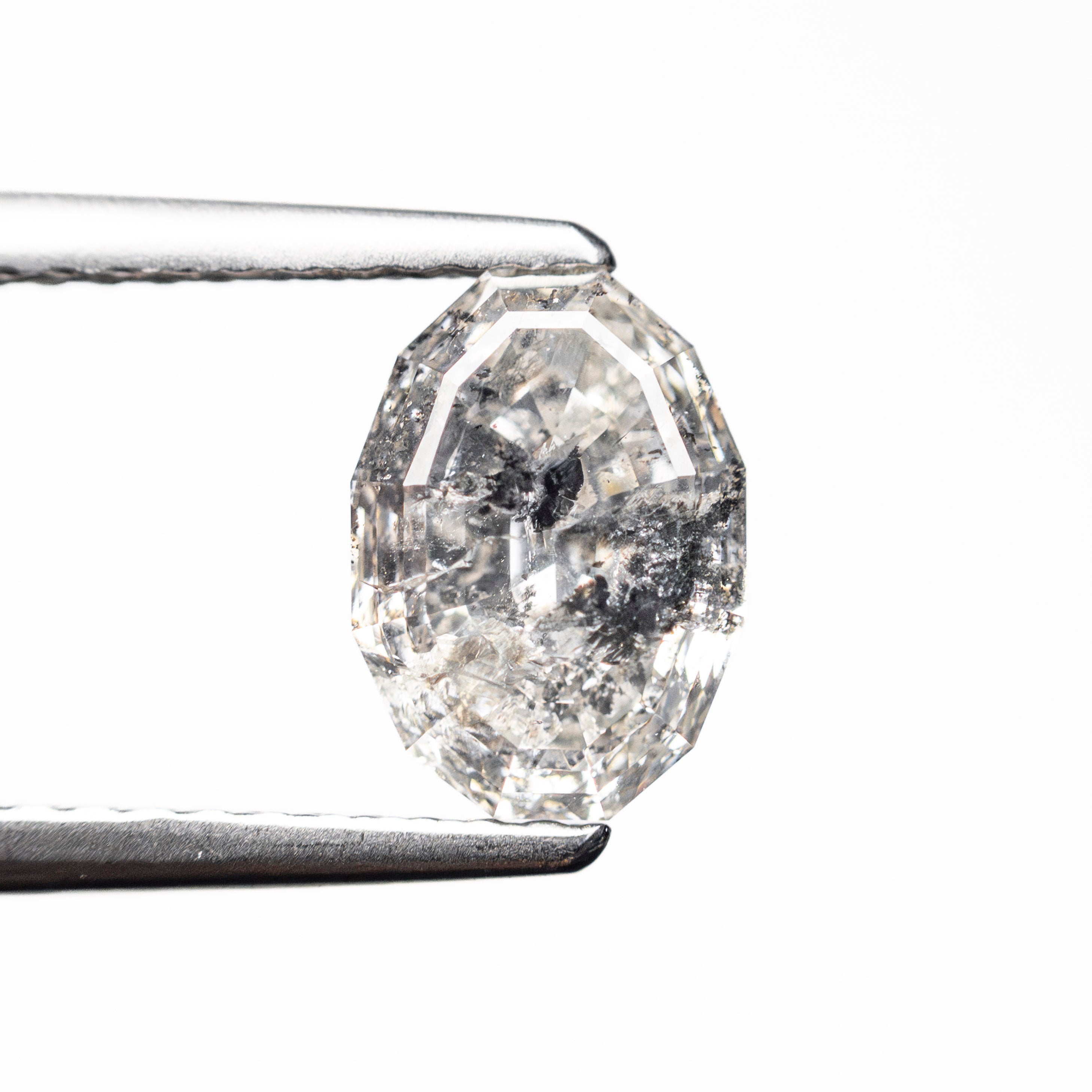 The 1.57ct 7.93x5.69mm Geo Oval Step Cut 🇨🇦 27638-01 by East London jeweller Rachel Boston | Discover our collections of unique and timeless engagement rings, wedding rings, and modern fine jewellery.