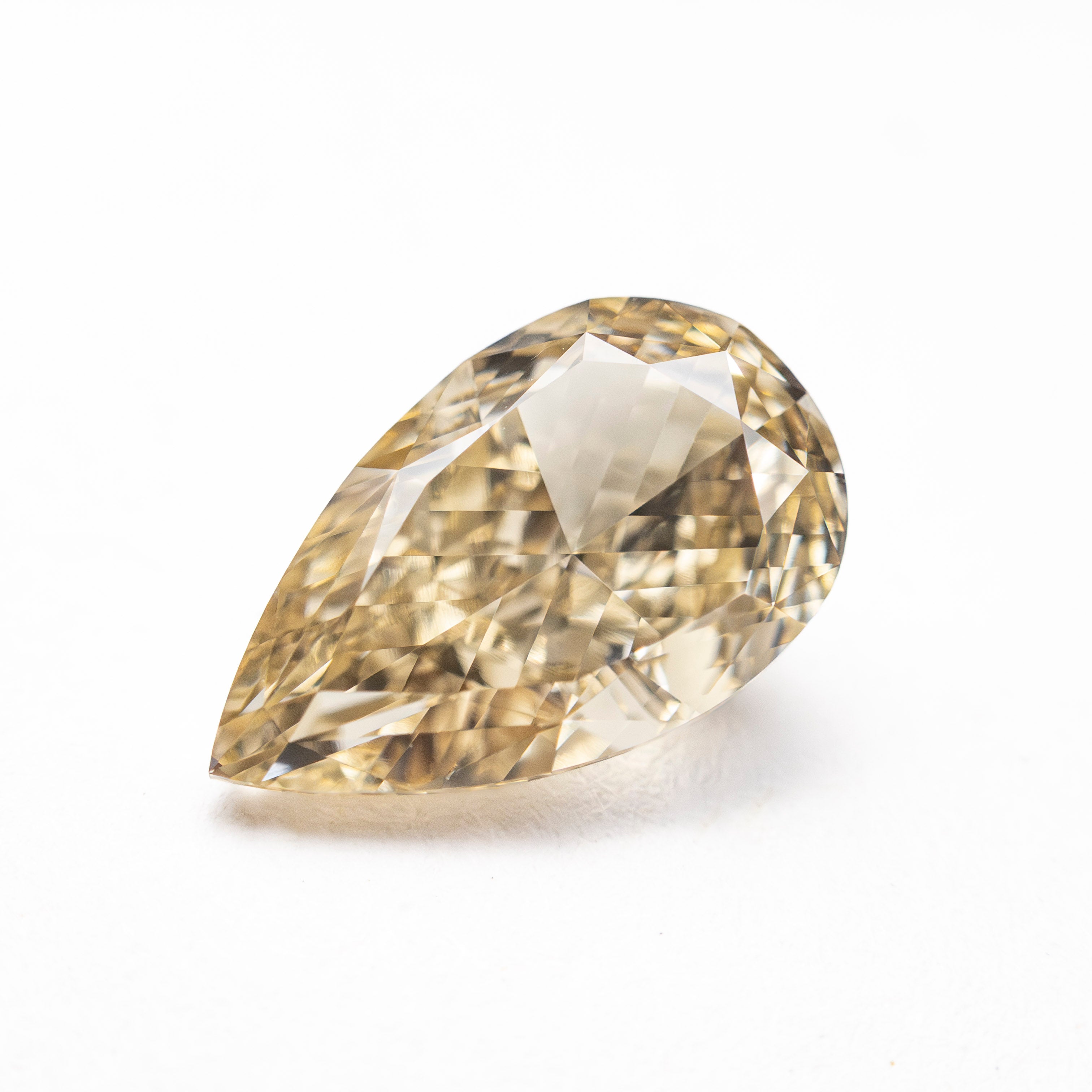 The 2.23ct 10.76x6.50x4.33mm GIA VVS2 Fancy Brownish Yellow Pear Brilliant 🇨🇦 27709-01 by East London jeweller Rachel Boston | Discover our collections of unique and timeless engagement rings, wedding rings, and modern fine jewellery.