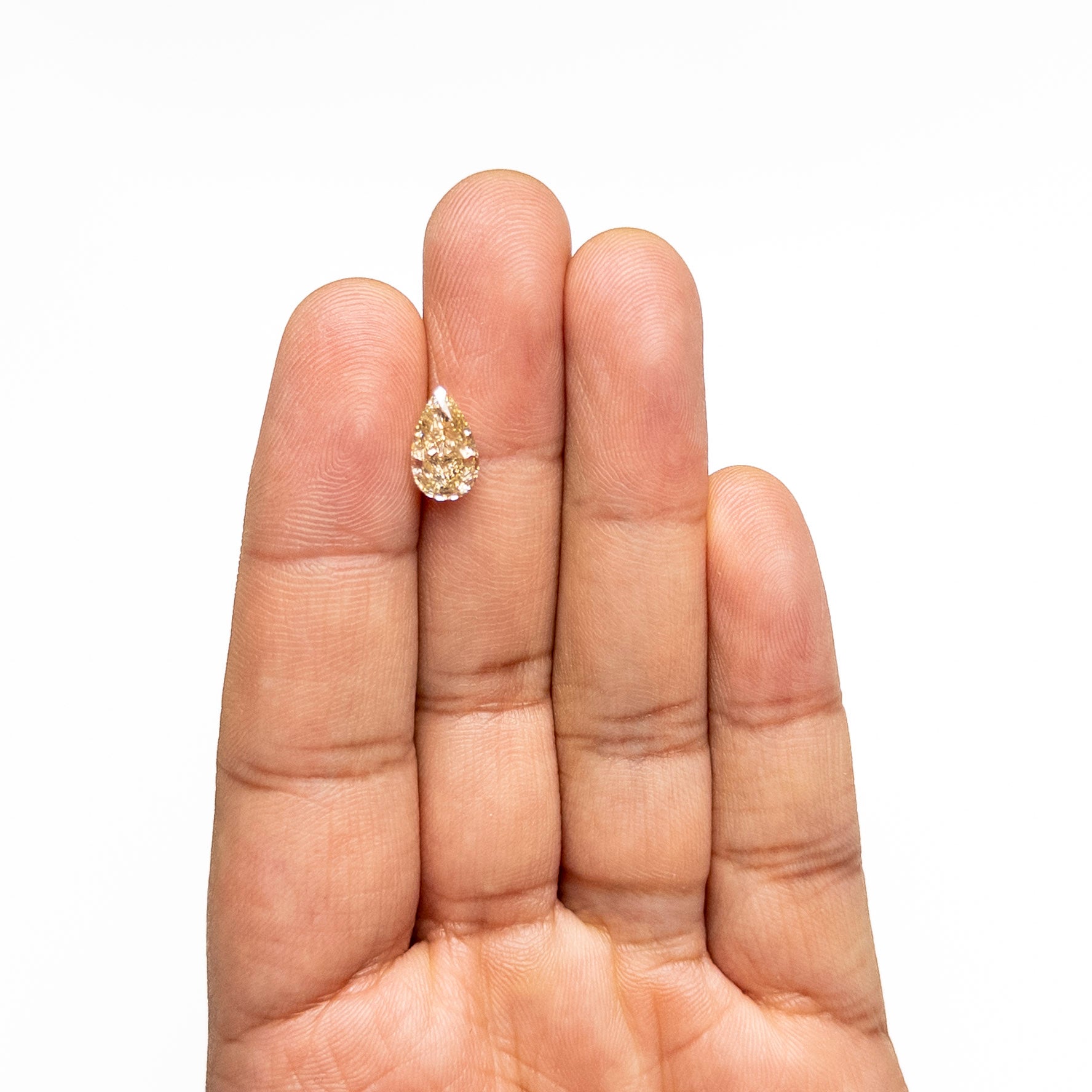 The 2.23ct 10.76x6.50x4.33mm GIA VVS2 Fancy Brownish Yellow Pear Brilliant 🇨🇦 27709-01 by East London jeweller Rachel Boston | Discover our collections of unique and timeless engagement rings, wedding rings, and modern fine jewellery.