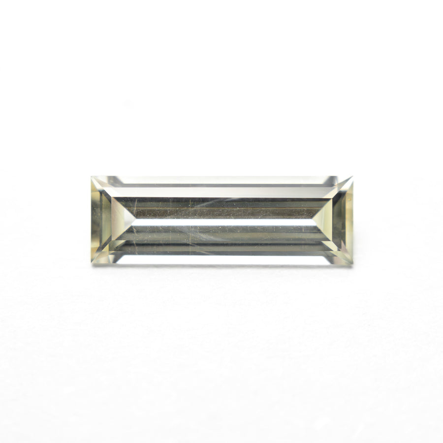 The 0.84ct 9.95x3.36x2.17mm Baguette Step Cut Sapphire 27719-01 by East London jeweller Rachel Boston | Discover our collections of unique and timeless engagement rings, wedding rings, and modern fine jewellery. - Rachel Boston Jewellery