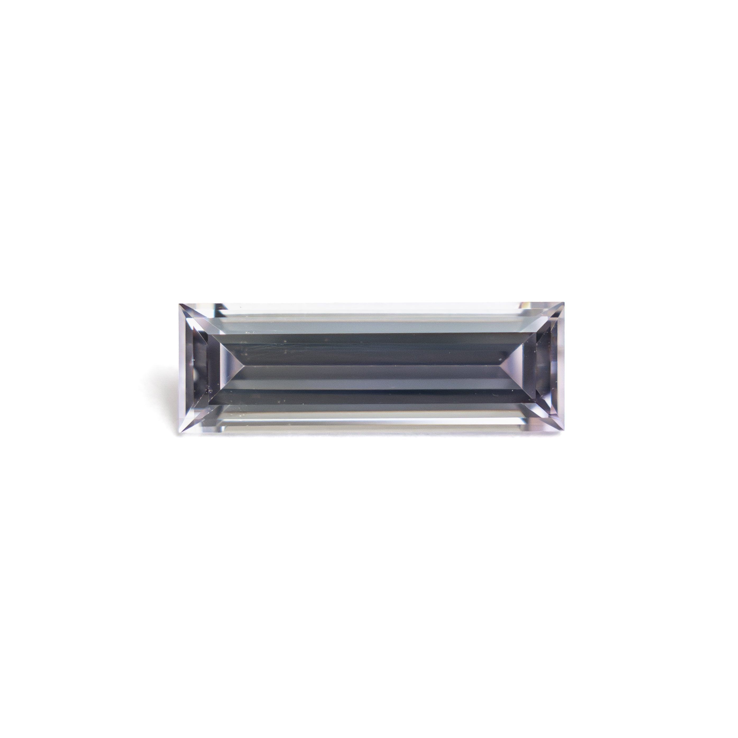 The 0.63ct 8.99x3.02x2.04mm Baguette Step Cut Sapphire 27720-02 by East London jeweller Rachel Boston | Discover our collections of unique and timeless engagement rings, wedding rings, and modern fine jewellery.