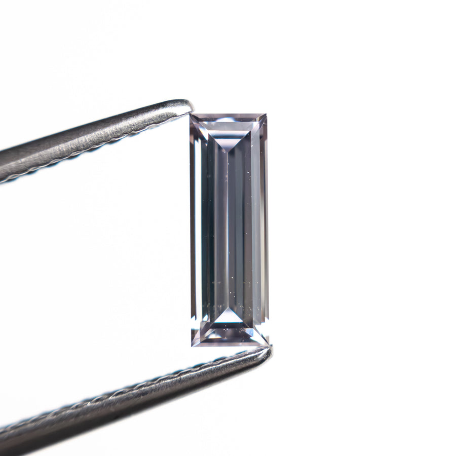 The 0.63ct 8.99x3.02x2.04mm Baguette Step Cut Sapphire 27720-02 by East London jeweller Rachel Boston | Discover our collections of unique and timeless engagement rings, wedding rings, and modern fine jewellery. - Rachel Boston Jewellery