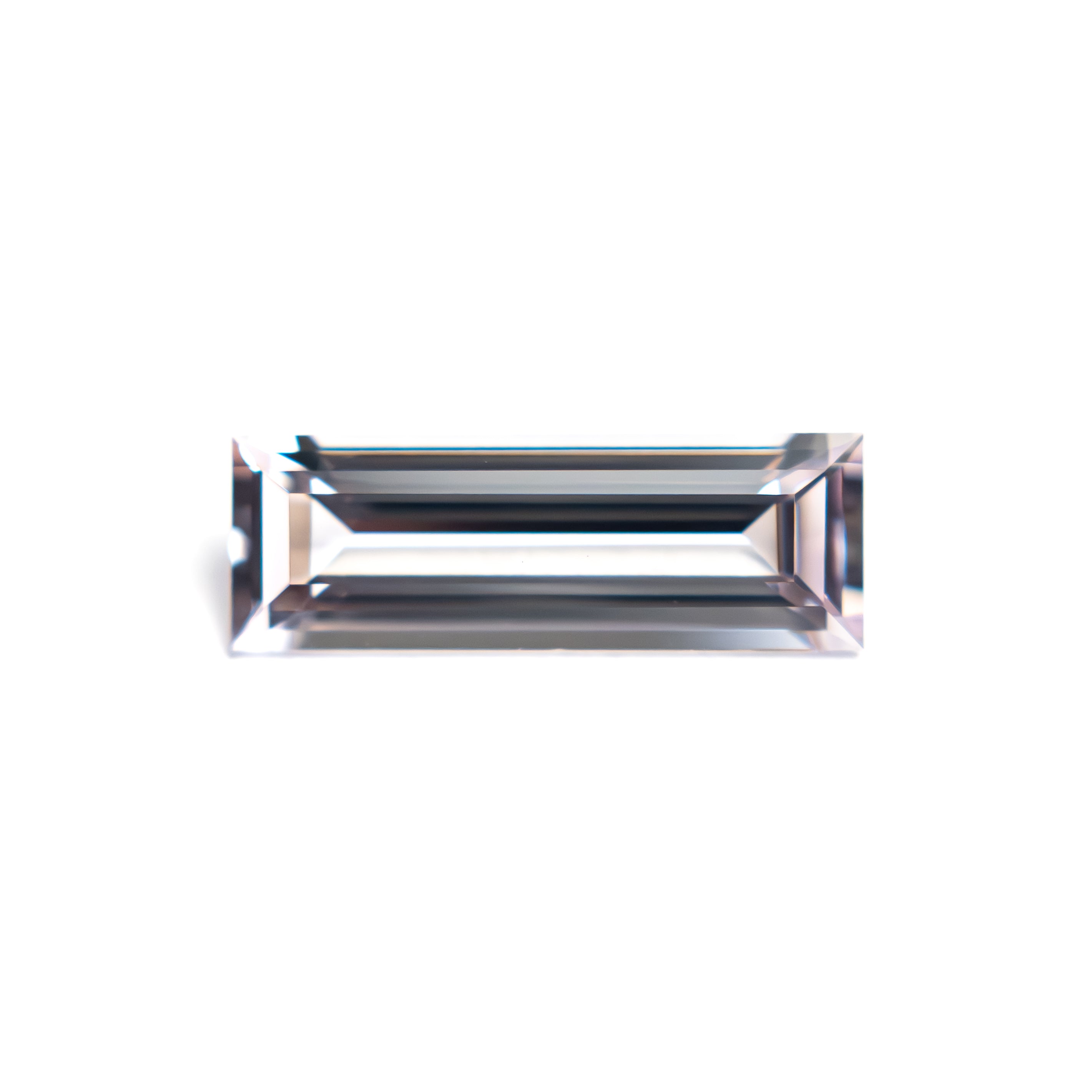 The 0.91ct 10.30x3.53x2.27mm Baguette Step Cut Sapphire 27720-06 by East London jeweller Rachel Boston | Discover our collections of unique and timeless engagement rings, wedding rings, and modern fine jewellery.