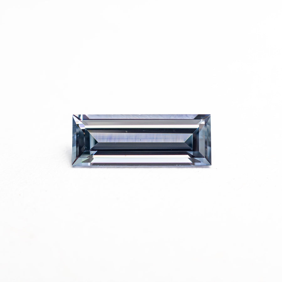 The 0.57ct 8.05x3.02x2.09mm Baguette Step Cut Sapphire 27721-02 by East London jeweller Rachel Boston | Discover our collections of unique and timeless engagement rings, wedding rings, and modern fine jewellery. - Rachel Boston Jewellery