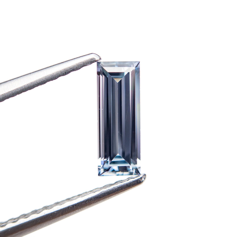 The 0.57ct 8.05x3.02x2.09mm Baguette Step Cut Sapphire 27721-02 by East London jeweller Rachel Boston | Discover our collections of unique and timeless engagement rings, wedding rings, and modern fine jewellery. - Rachel Boston Jewellery