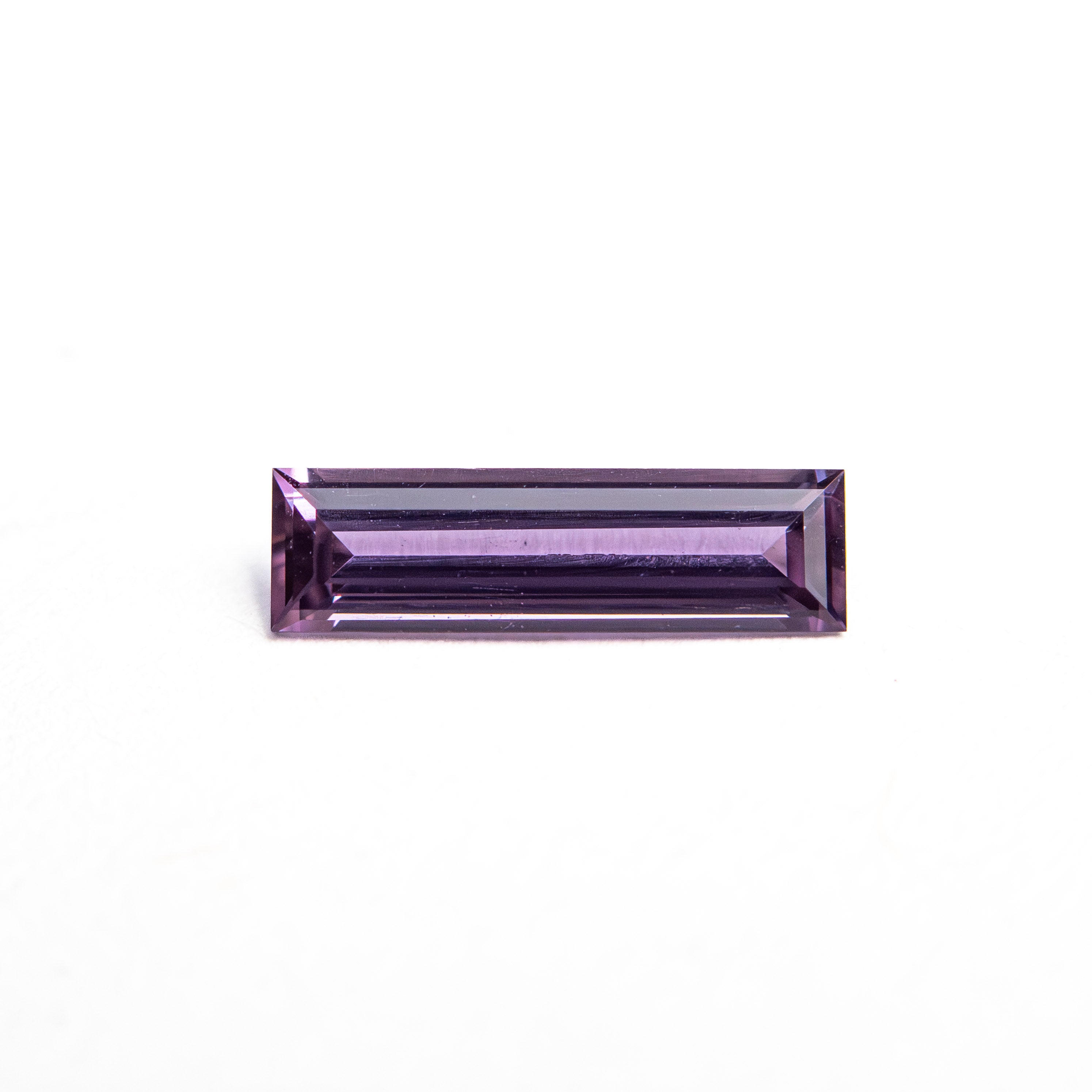 The 0.39ct 8.54x2.47x1.62mm Baguette Step Cut Sapphire 27721-05 by East London jeweller Rachel Boston | Discover our collections of unique and timeless engagement rings, wedding rings, and modern fine jewellery.