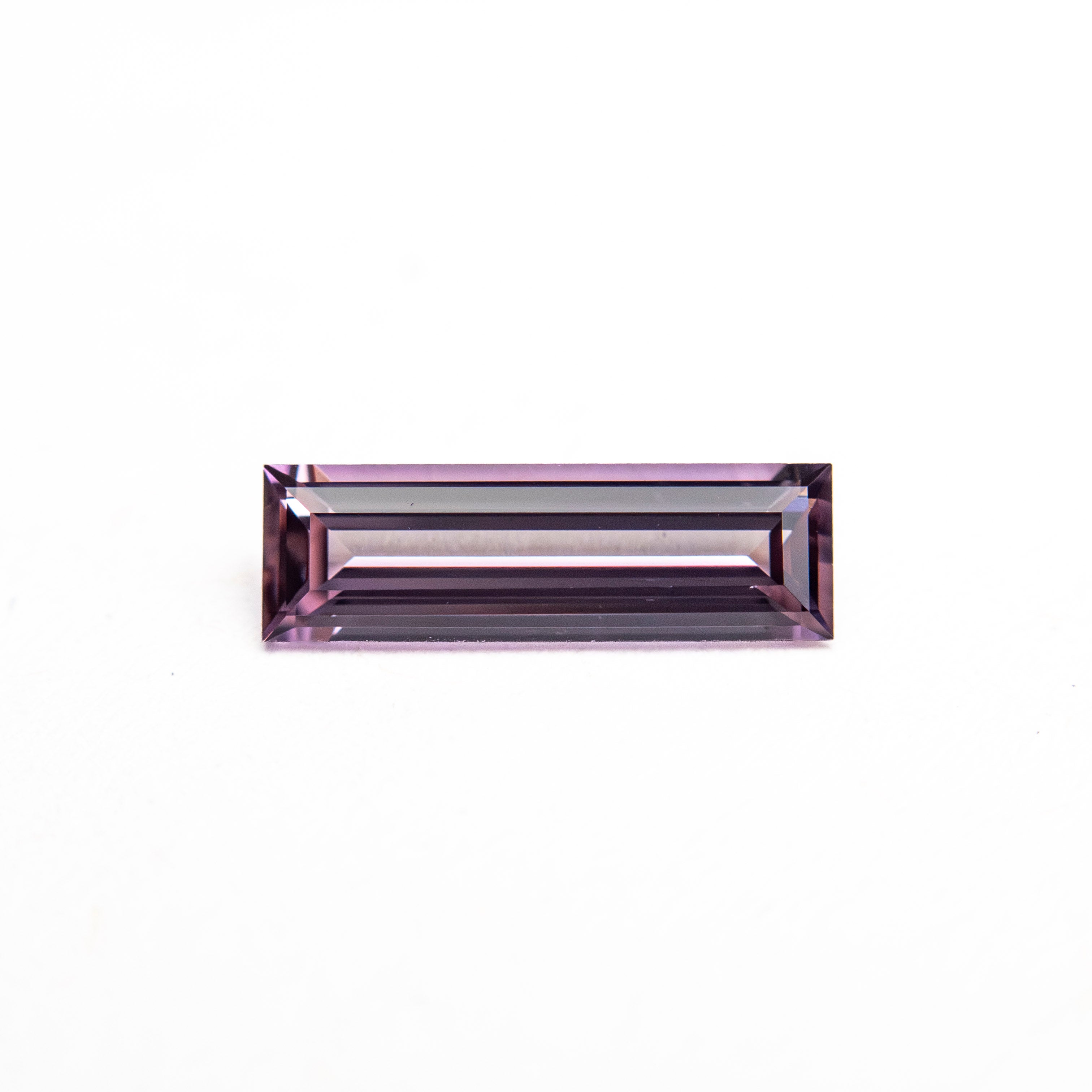 The 0.52ct 8.73x2.73x1.87mm Baguette Step Cut Sapphire 27721-06 by East London jeweller Rachel Boston | Discover our collections of unique and timeless engagement rings, wedding rings, and modern fine jewellery.