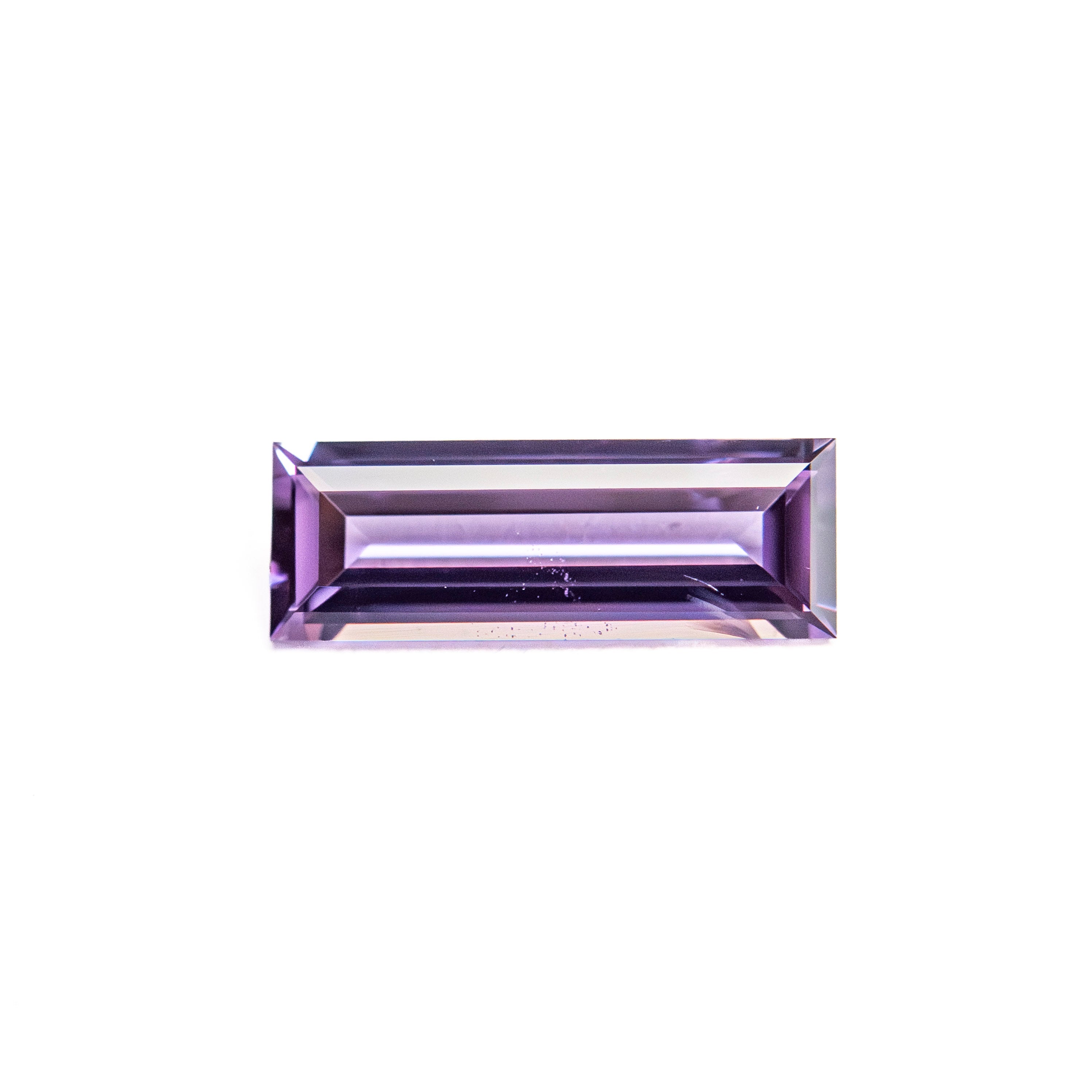The 0.53ct 8.54x3.04x1.74mm Baguette Step Cut Sapphire 27721-09 by East London jeweller Rachel Boston | Discover our collections of unique and timeless engagement rings, wedding rings, and modern fine jewellery.