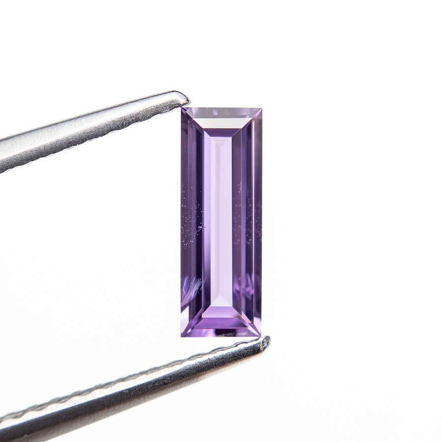 The 0.53ct 8.54x3.04x1.74mm Baguette Step Cut Sapphire 27721-09 by East London jeweller Rachel Boston | Discover our collections of unique and timeless engagement rings, wedding rings, and modern fine jewellery. - Rachel Boston Jewellery