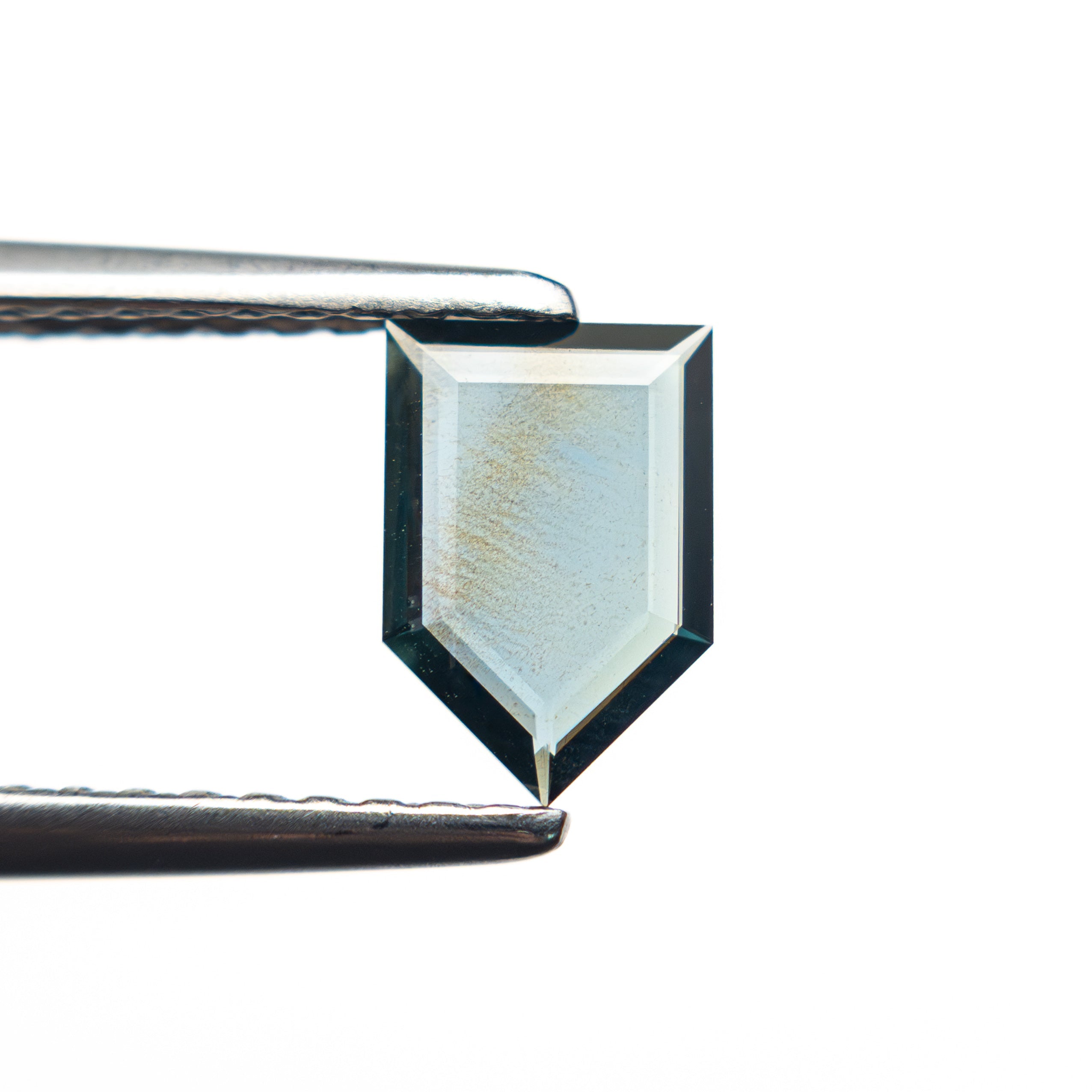 The 0.50ct 7.08x4.77x1.20mm Shield Portrait Cut Sapphire 27730-03 by East London jeweller Rachel Boston | Discover our collections of unique and timeless engagement rings, wedding rings, and modern fine jewellery.