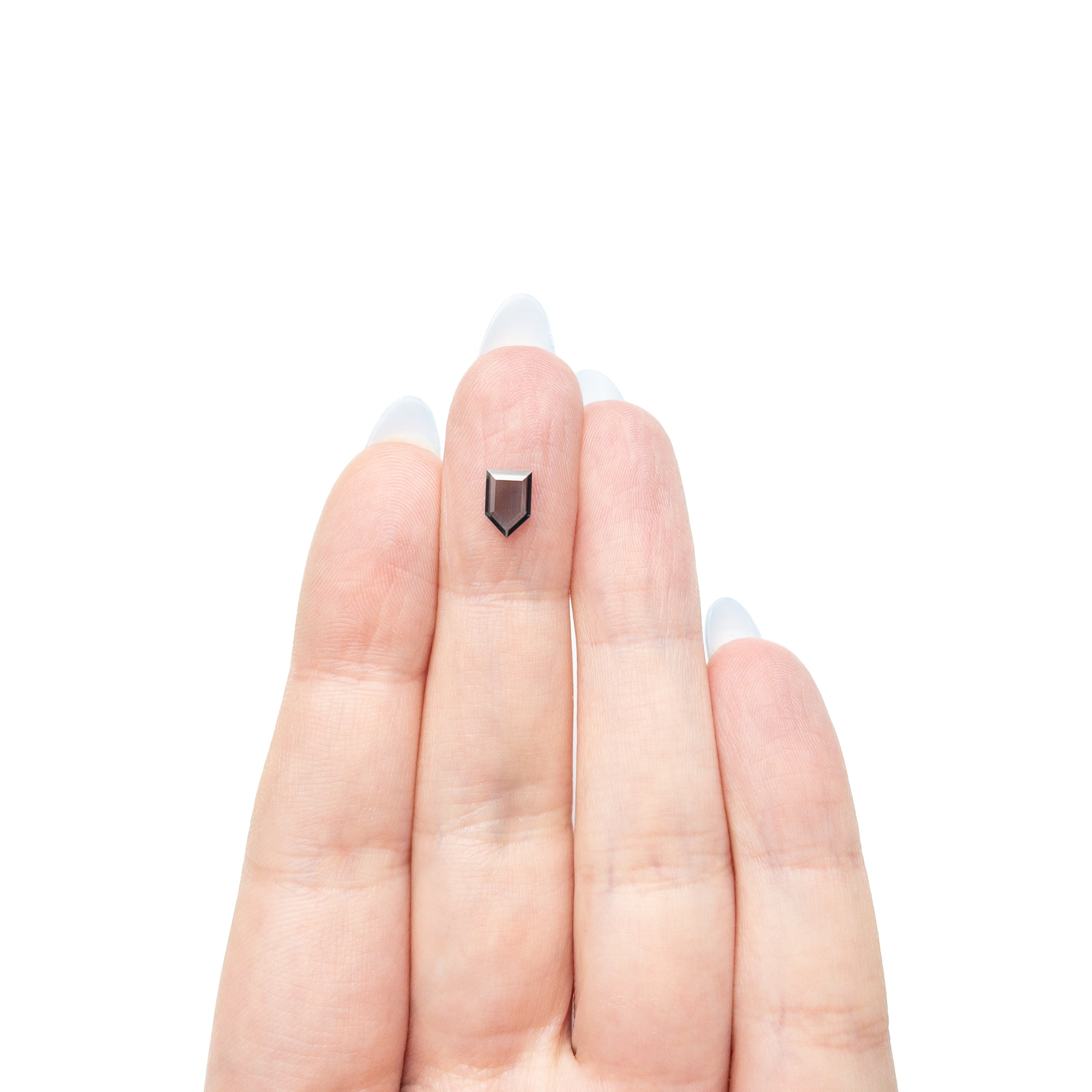 The 0.50ct 7.08x4.77x1.20mm Shield Portrait Cut Sapphire 27730-03 by East London jeweller Rachel Boston | Discover our collections of unique and timeless engagement rings, wedding rings, and modern fine jewellery.
