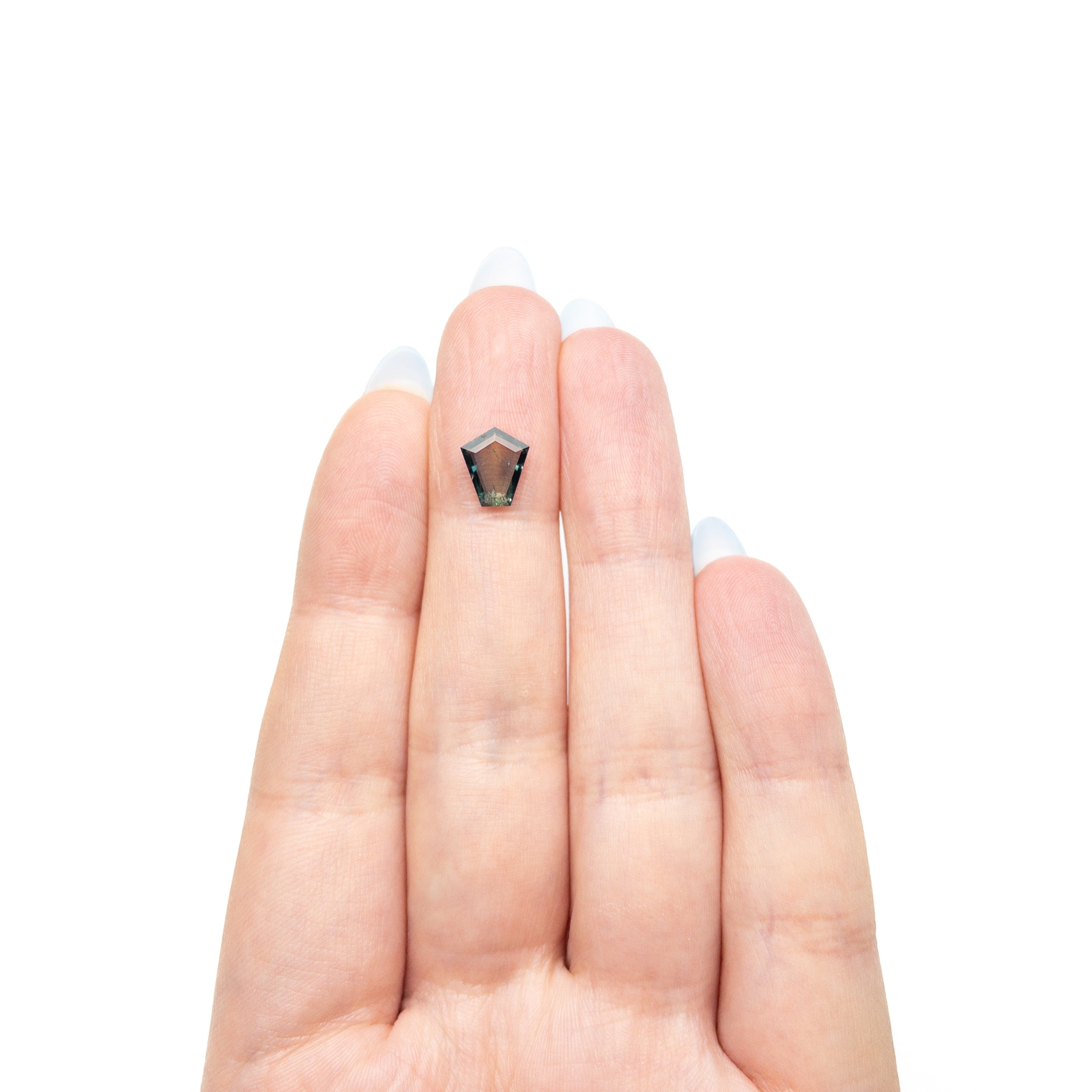 The 1.04ct 8.63x7.51x1.66mm Shield Portrait Cut Sapphire 27730-04 by East London jeweller Rachel Boston | Discover our collections of unique and timeless engagement rings, wedding rings, and modern fine jewellery.