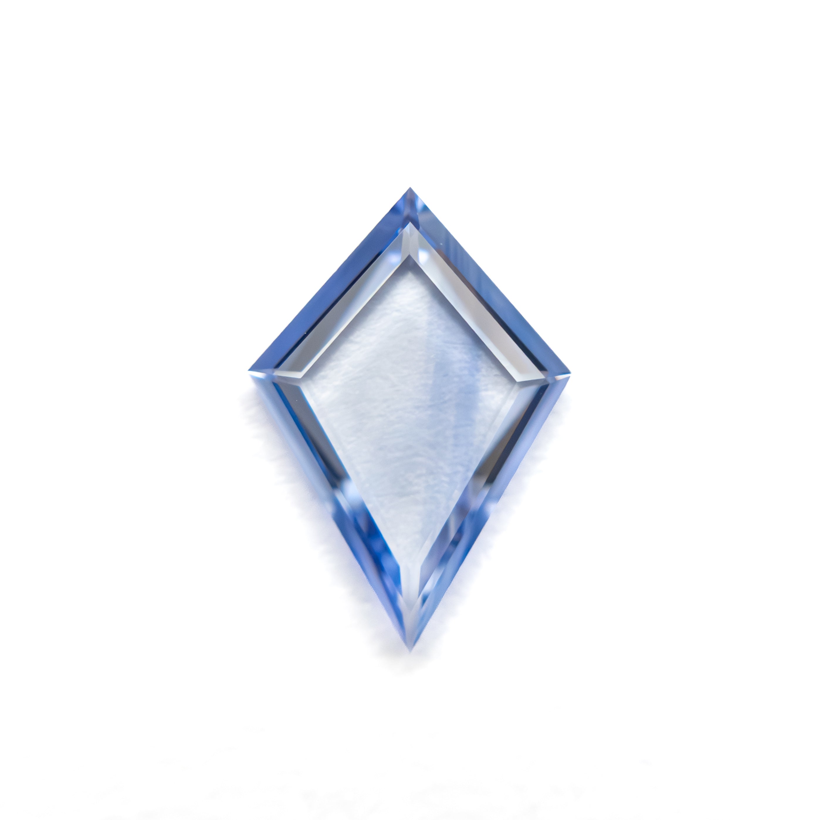 The 0.61ct 9.49x6.57x1.31mm Kite Portrait Cut Sapphire 27740-07 by East London jeweller Rachel Boston | Discover our collections of unique and timeless engagement rings, wedding rings, and modern fine jewellery.