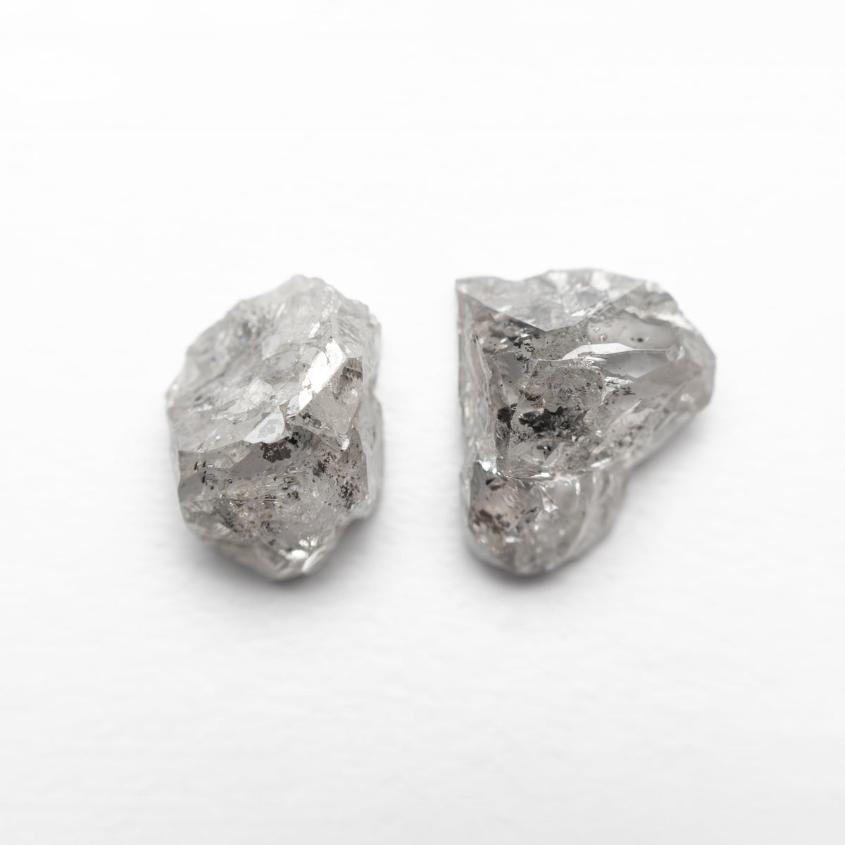 The 3.30cttw 2pc 8.32x6.09x4.01mm 8.63x7.03x3.74mm Polished Raw Diamond Matching Pair 🇨🇦 27968-01 by East London jeweller Rachel Boston | Discover our collections of unique and timeless engagement rings, wedding rings, and modern fine jewellery.