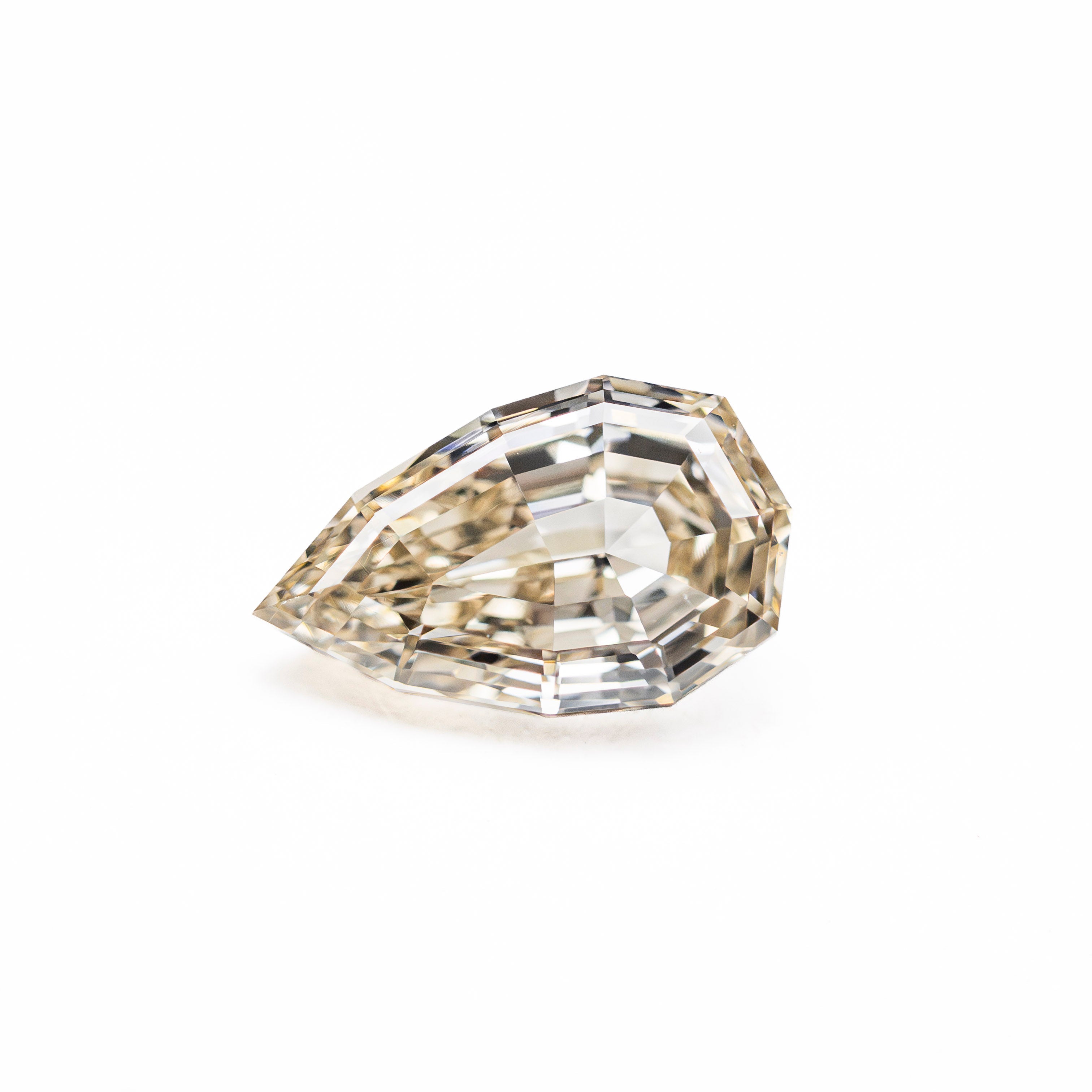 The 1.06ct 8.52x5.22x3.28mm VVS2 W-X Geo Pear Step Cut 28054-01 by East London jeweller Rachel Boston | Discover our collections of unique and timeless engagement rings, wedding rings, and modern fine jewellery.