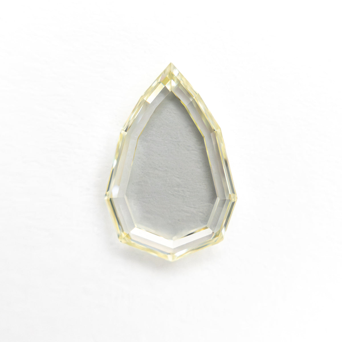 The 1.27ct 10.22x6.81x1.99mm GIA VS1 Q-R Geo Pear Portrait Cut 28329-01 by East London jeweller Rachel Boston | Discover our collections of unique and timeless engagement rings, wedding rings, and modern fine jewellery.