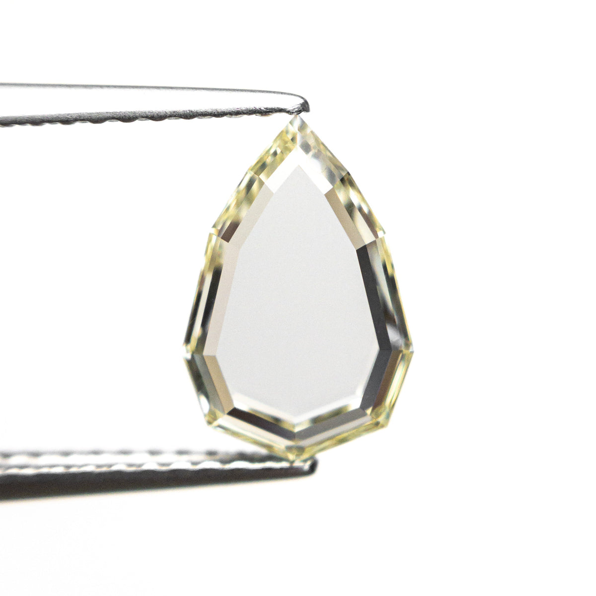 The 1.27ct 10.22x6.81x1.99mm GIA VS1 Q-R Geo Pear Portrait Cut 28329-01 by East London jeweller Rachel Boston | Discover our collections of unique and timeless engagement rings, wedding rings, and modern fine jewellery.