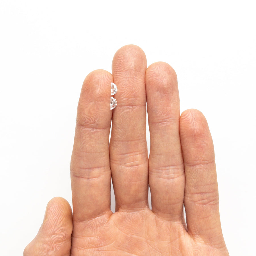 The 0.32cttw 2pc 5.80x2.93x1.37mm 5.95x3.02x1.48mm D-E VVS Half Moon Brilliant Matching Pair 26309-01 by East London jeweller Rachel Boston | Discover our collections of unique and timeless engagement rings, wedding rings, and modern fine jewellery. - Rachel Boston Jewellery