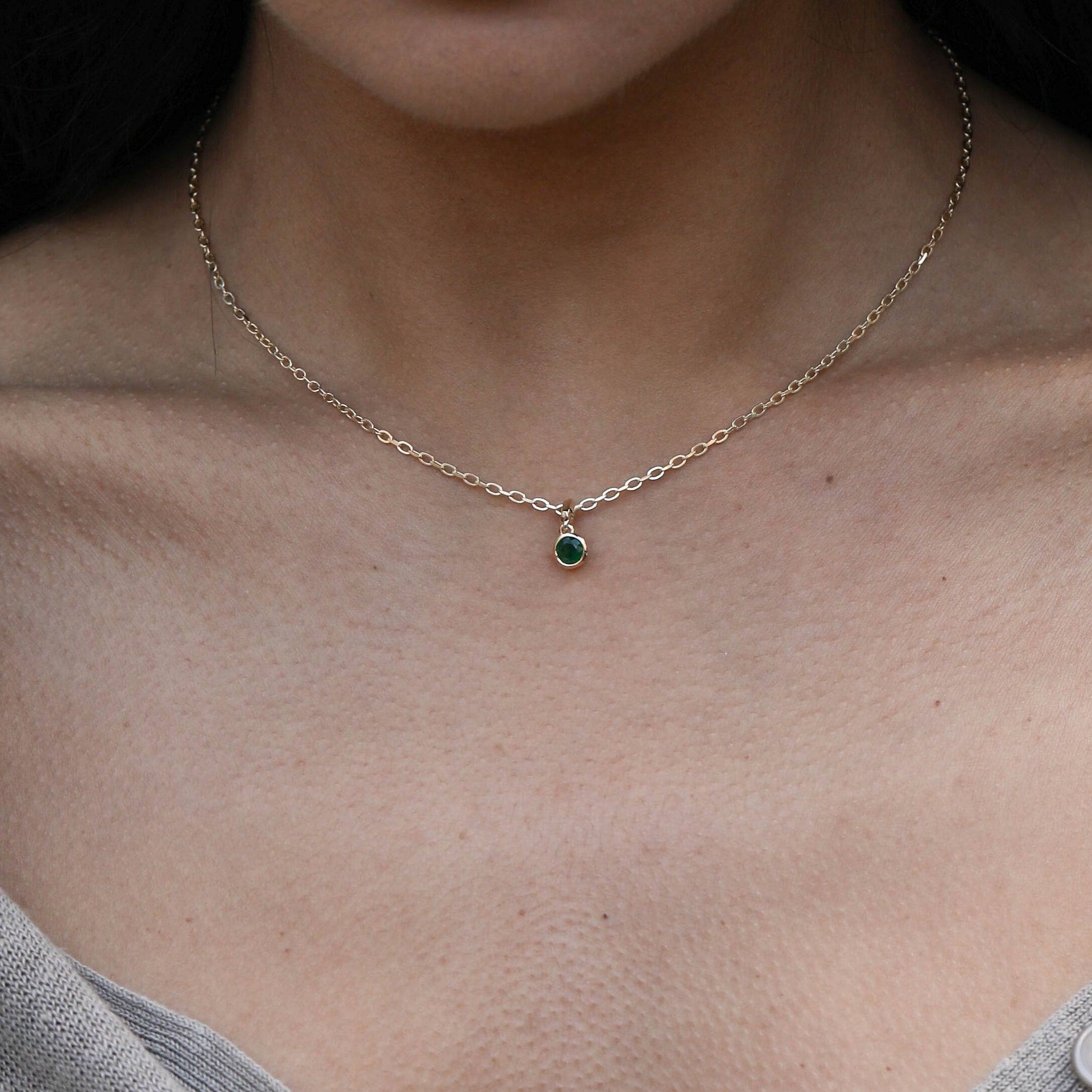The Large Droplet Emerald Necklace by East London jeweller Rachel Boston | Discover our collections of unique and timeless engagement rings, wedding rings, and modern fine jewellery.