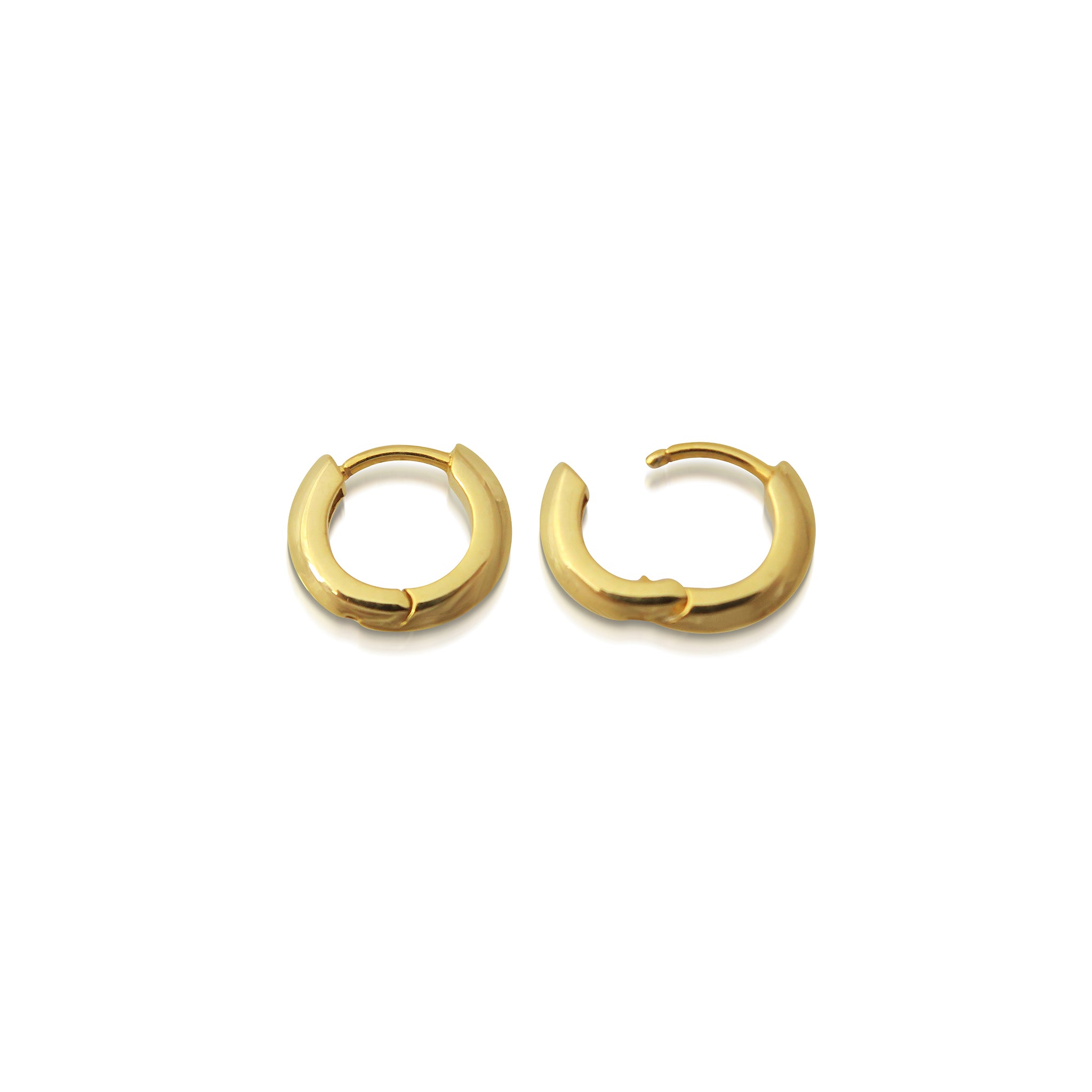 The 10mm Knife Edge Huggie Hoop Earrings by East London jeweller Rachel Boston | Discover our collections of unique and timeless engagement rings, wedding rings, and modern fine jewellery.