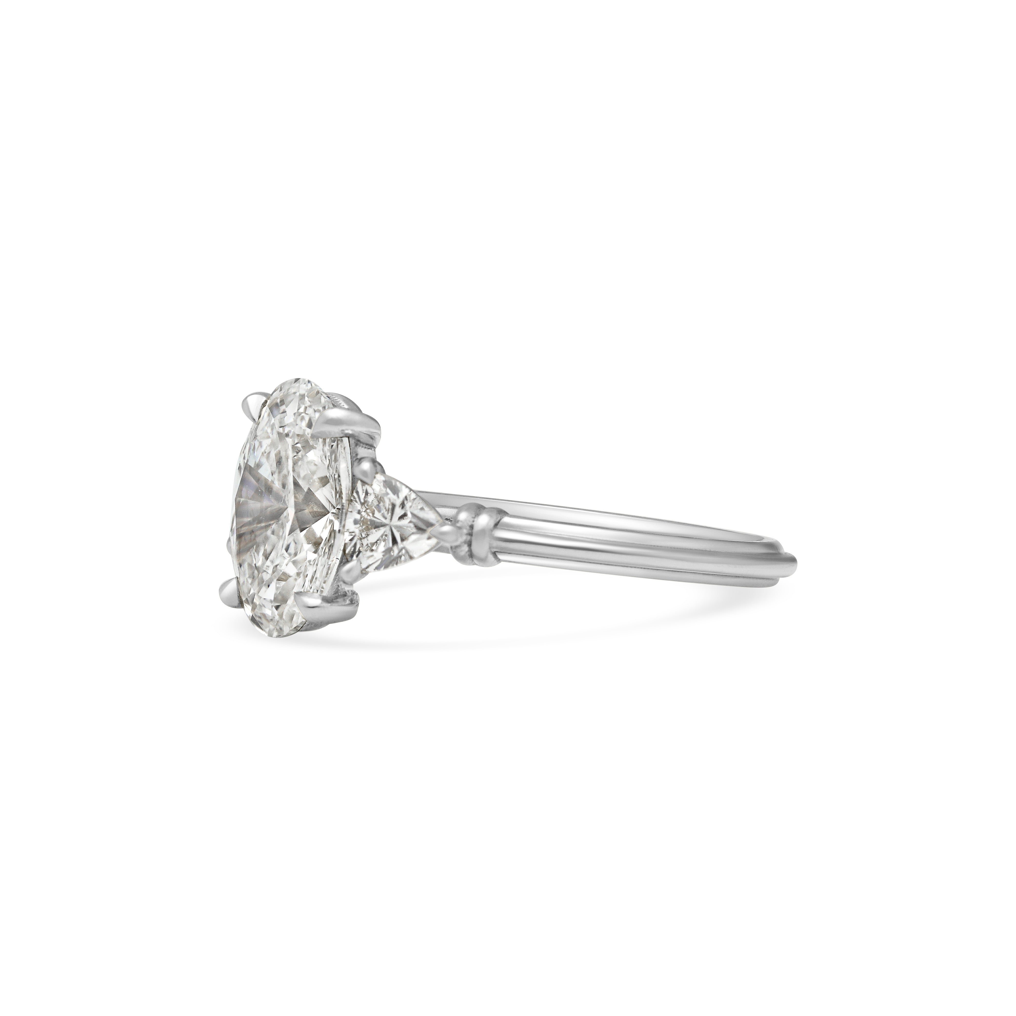 The Clara Ring - Oval Cut by East London jeweller Rachel Boston | Discover our collections of unique and timeless engagement rings, wedding rings, and modern fine jewellery.