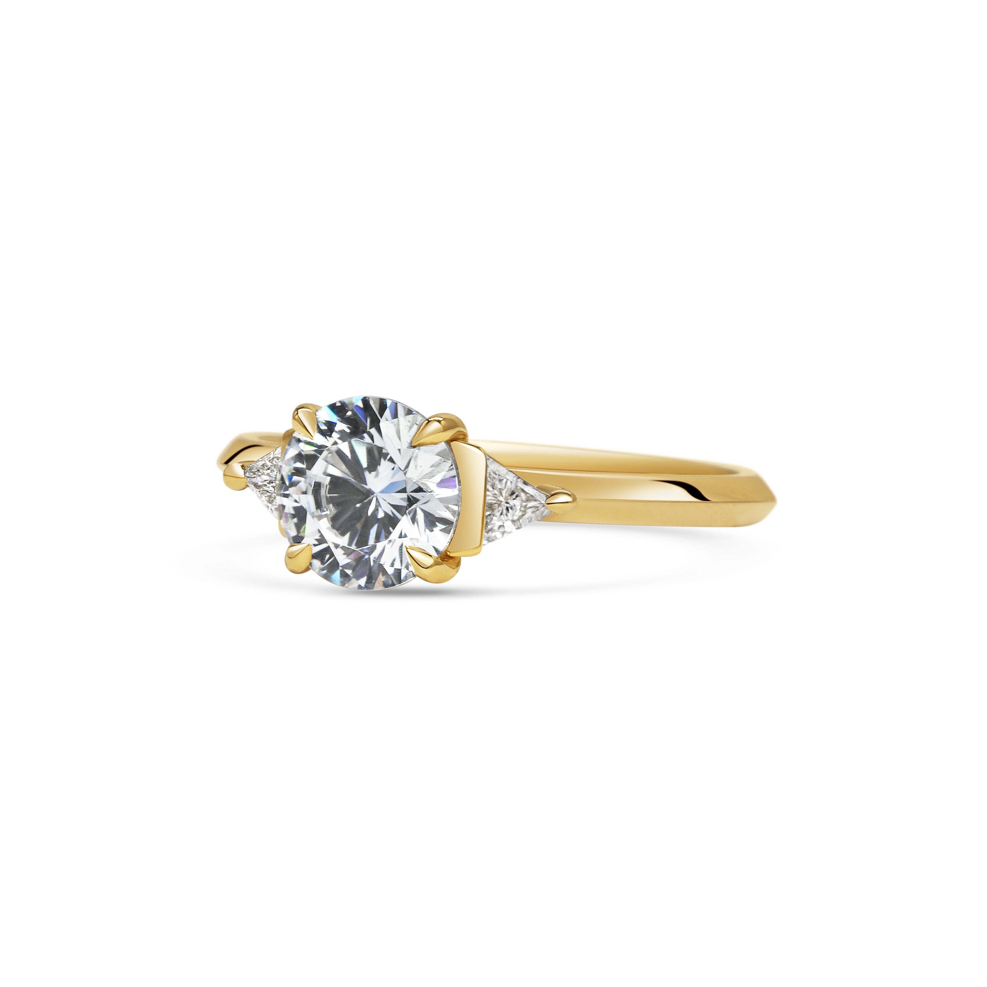 The Crux Ring - Round Cut by East London jeweller Rachel Boston | Discover our collections of unique and timeless engagement rings, wedding rings, and modern fine jewellery.