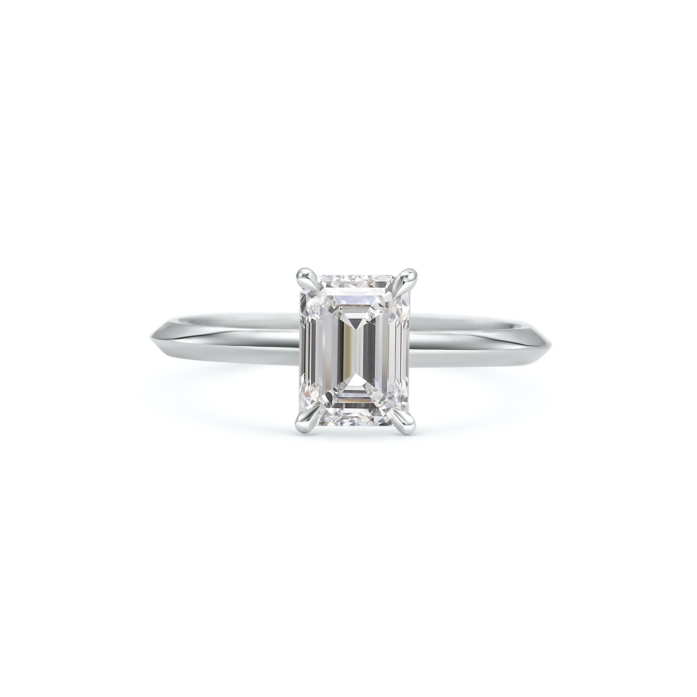 The Grace Ring - Emerald Cut by East London jeweller Rachel Boston | Discover our collections of unique and timeless engagement rings, wedding rings, and modern fine jewellery.