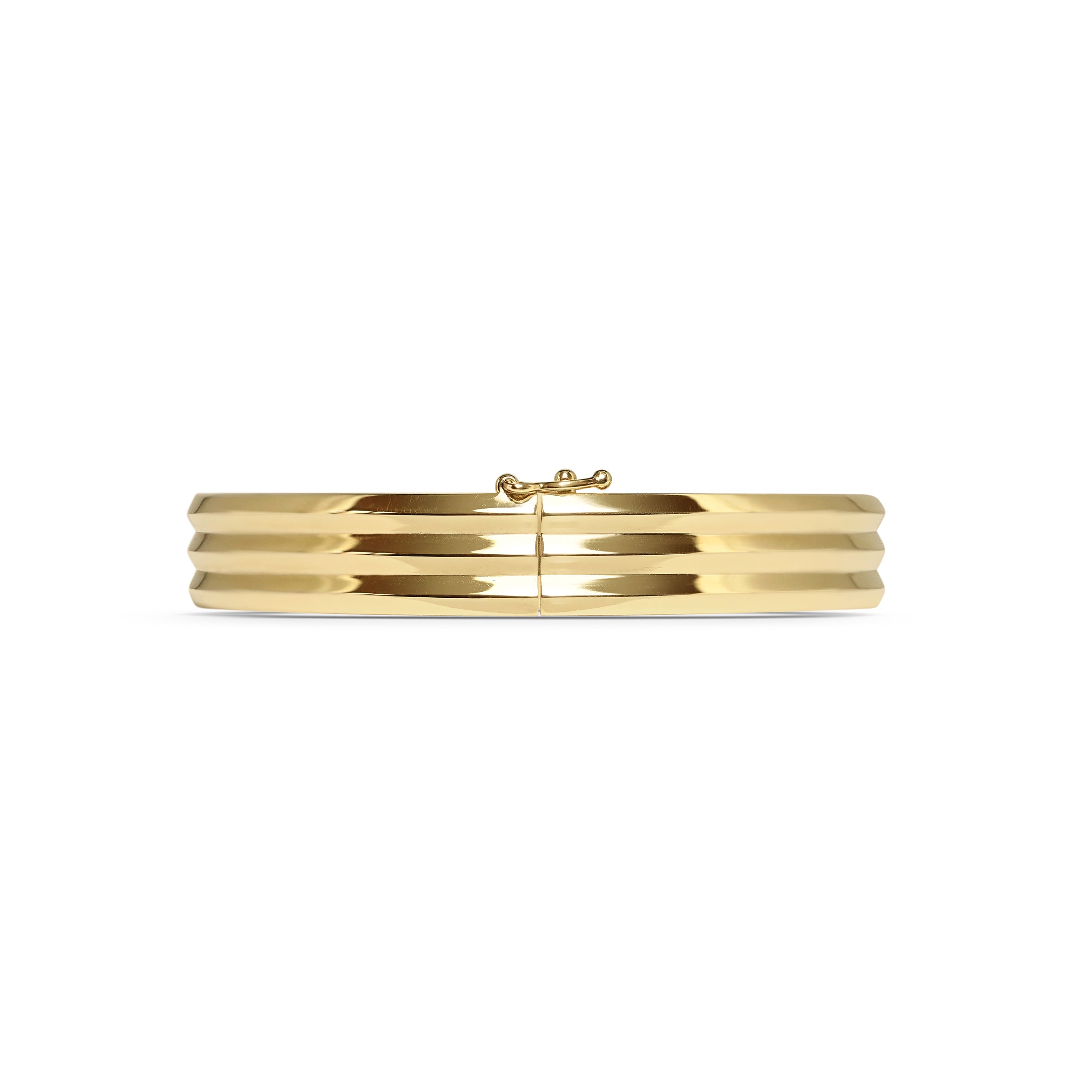 The Heavy Triple Knife Edge Bangle by East London jeweller Rachel Boston | Discover our collections of unique and timeless engagement rings, wedding rings, and modern fine jewellery.