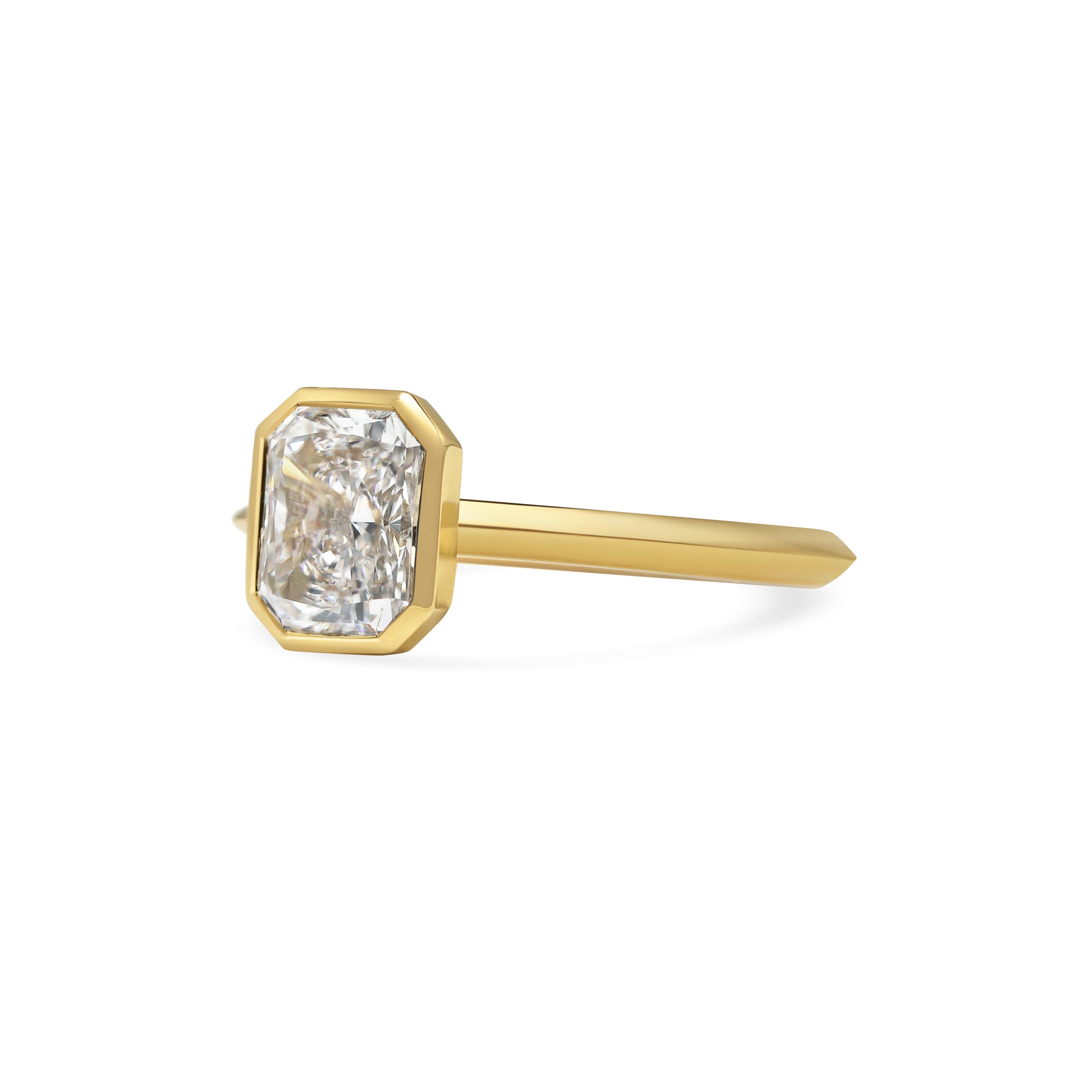 The Ines Ring - Radiant Cut by East London jeweller Rachel Boston | Discover our collections of unique and timeless engagement rings, wedding rings, and modern fine jewellery.