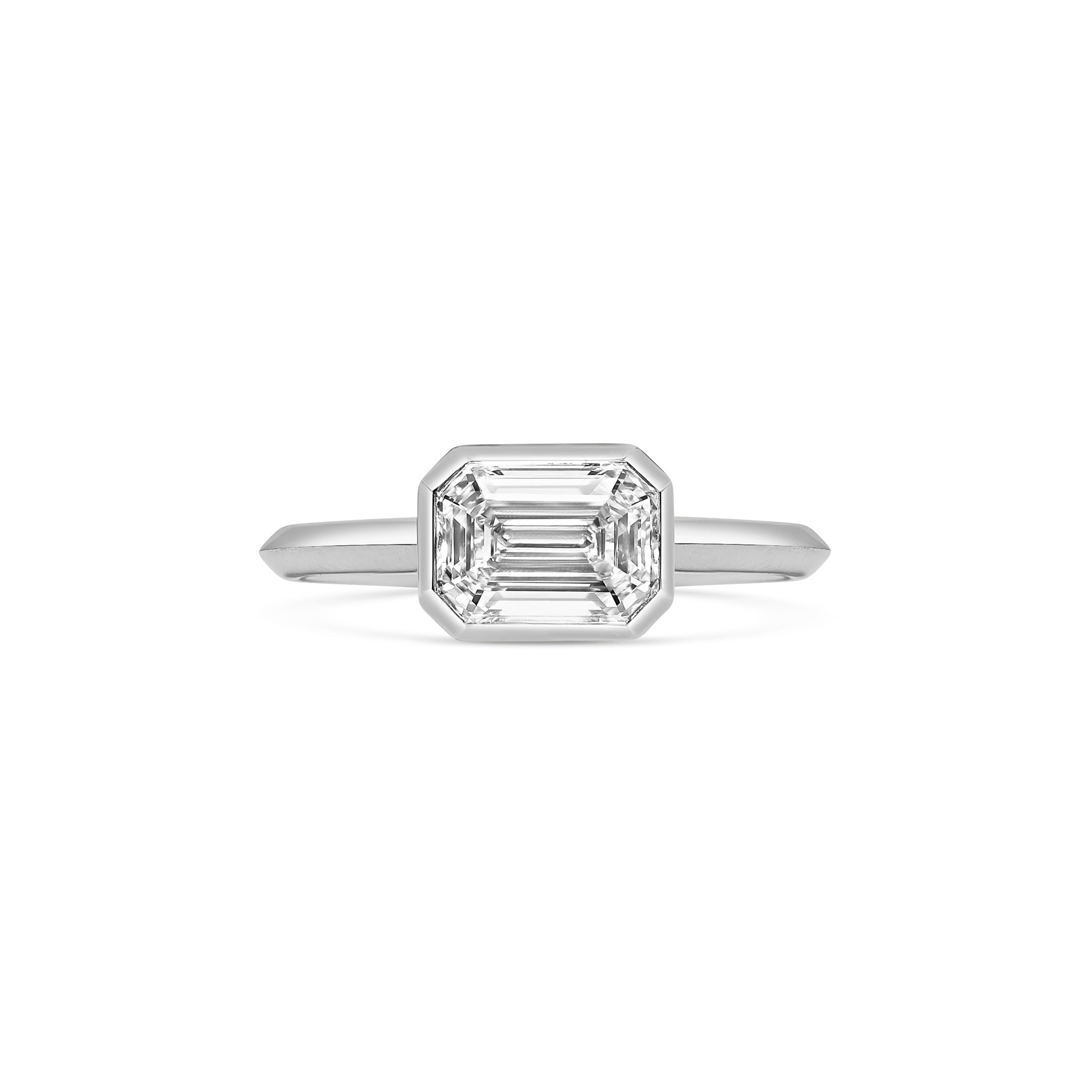 The Ines Ring - Emerald Cut by East London jeweller Rachel Boston | Discover our collections of unique and timeless engagement rings, wedding rings, and modern fine jewellery.