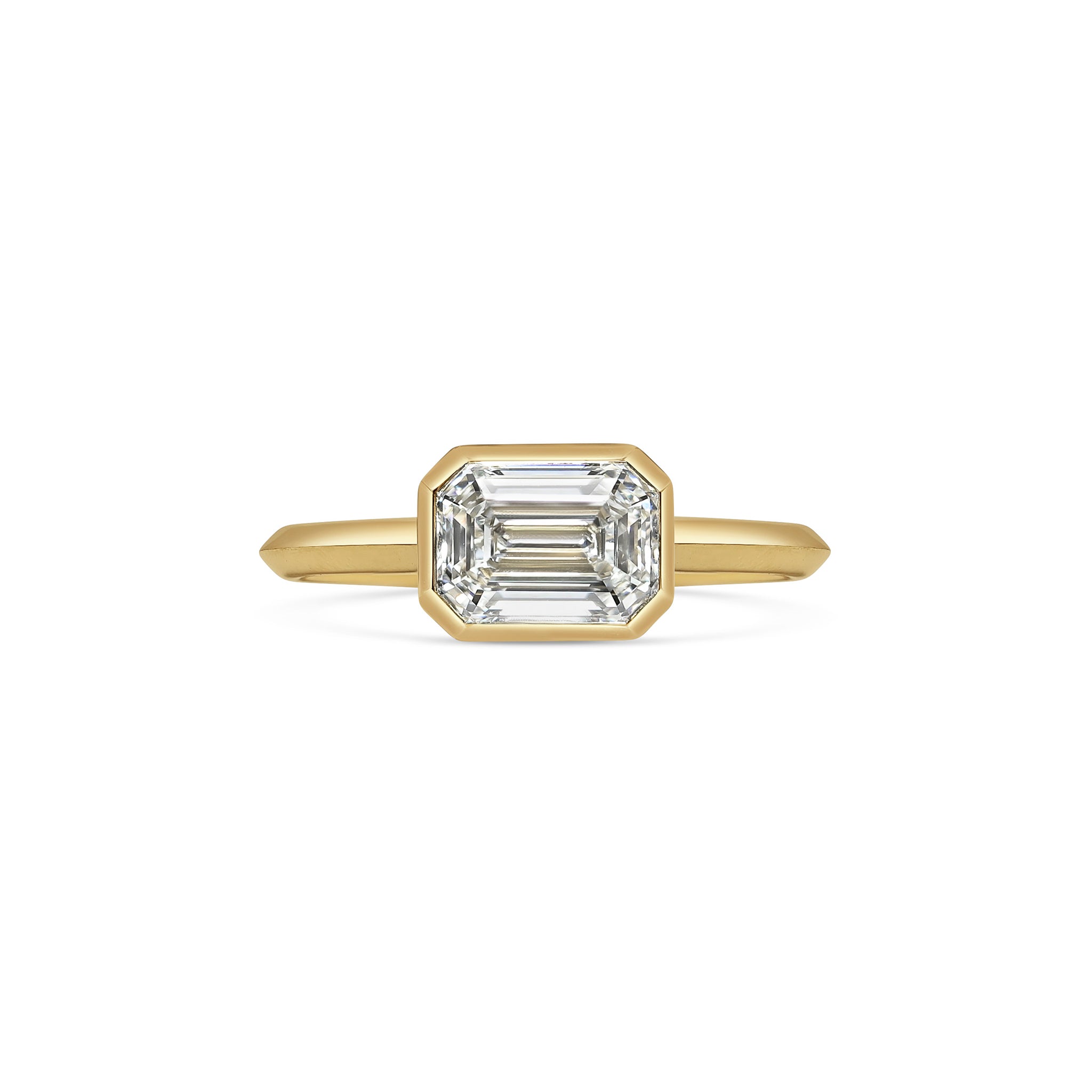 The Ines Ring - Emerald Cut by East London jeweller Rachel Boston | Discover our collections of unique and timeless engagement rings, wedding rings, and modern fine jewellery.