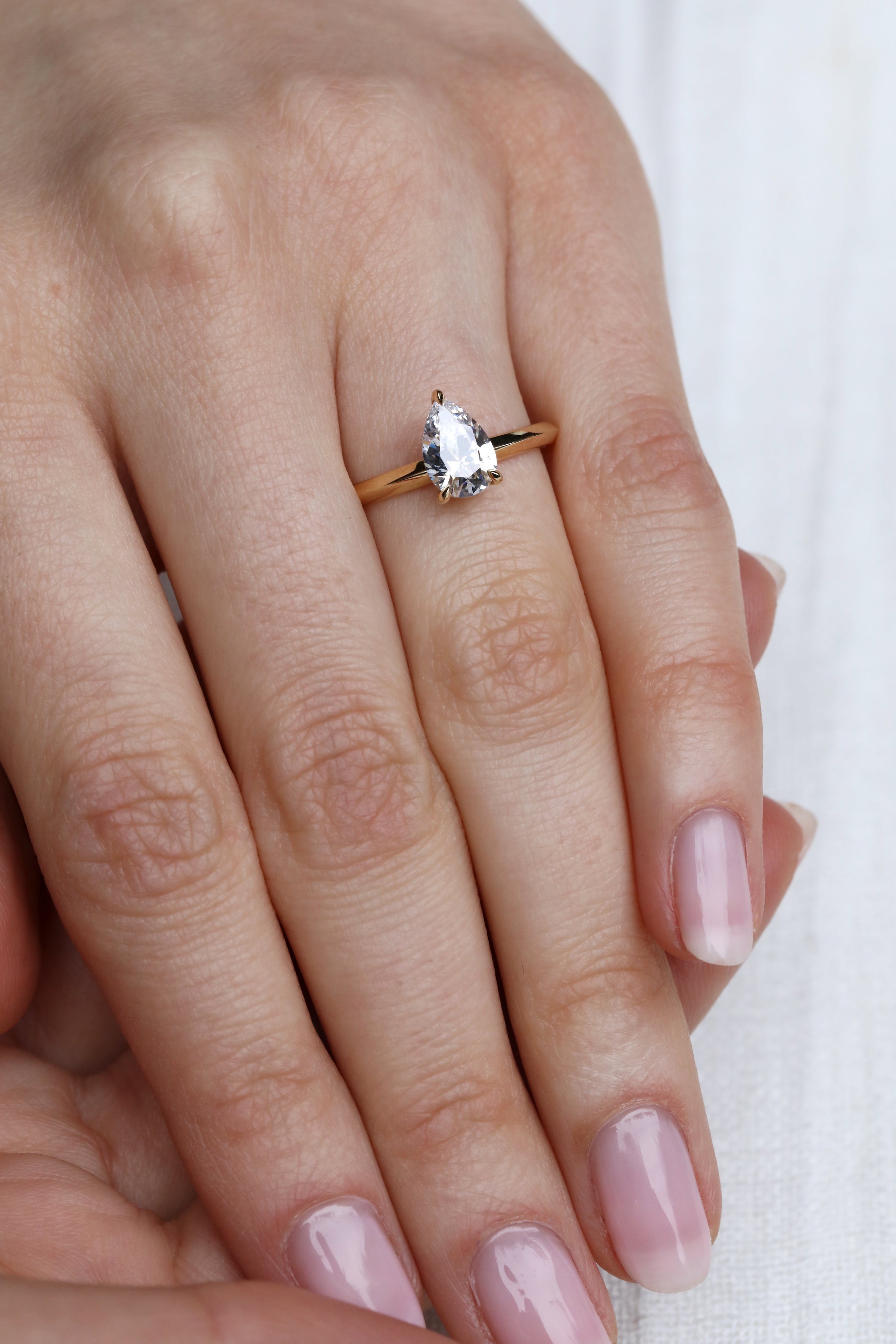 The Lyra Ring - Pear Cut by East London jeweller Rachel Boston | Discover our collections of unique and timeless engagement rings, wedding rings, and modern fine jewellery.
