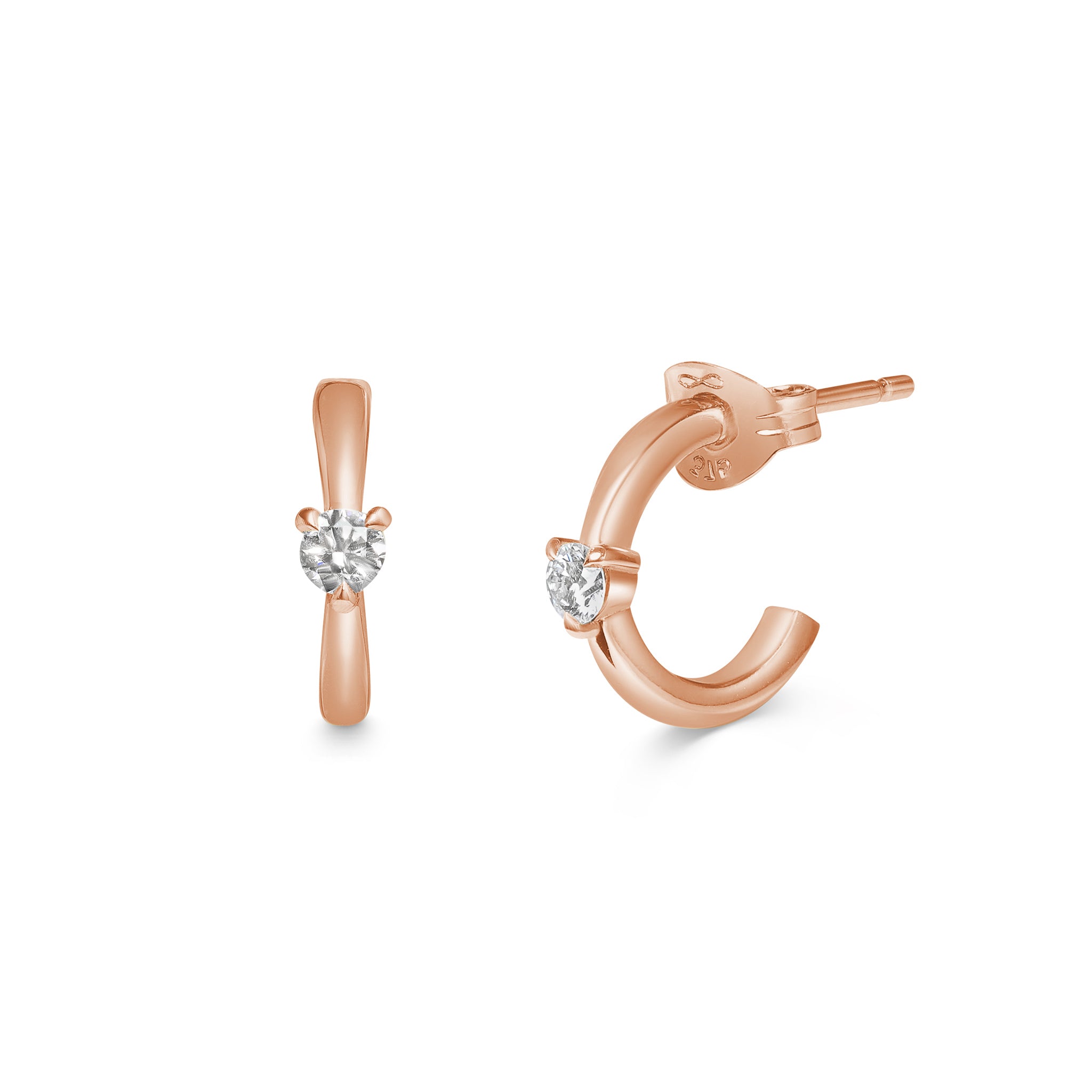 The Diamond Pinched Huggie Earrings by East London jeweller Rachel Boston | Discover our collections of unique and timeless engagement rings, wedding rings, and modern fine jewellery.
