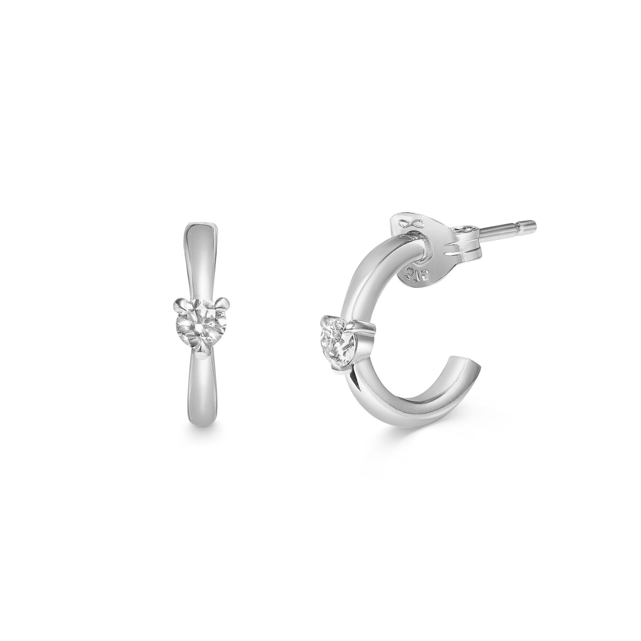 The Diamond Pinched Huggie Earrings by East London jeweller Rachel Boston | Discover our collections of unique and timeless engagement rings, wedding rings, and modern fine jewellery.