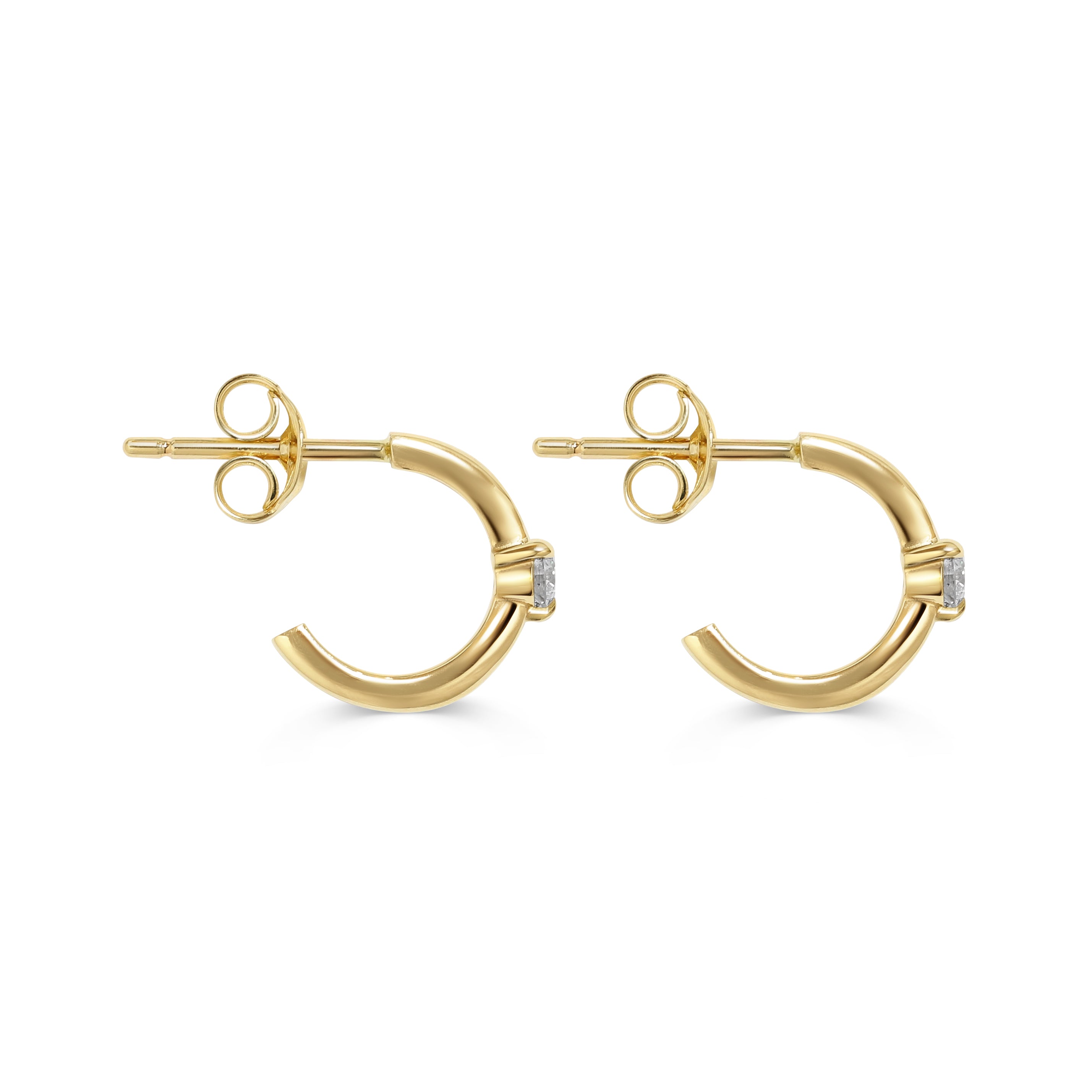 The Diamond Pinched Huggie Earrings by East London jeweller Rachel Boston | Discover our collections of unique and timeless engagement rings, wedding rings, and modern fine jewellery.