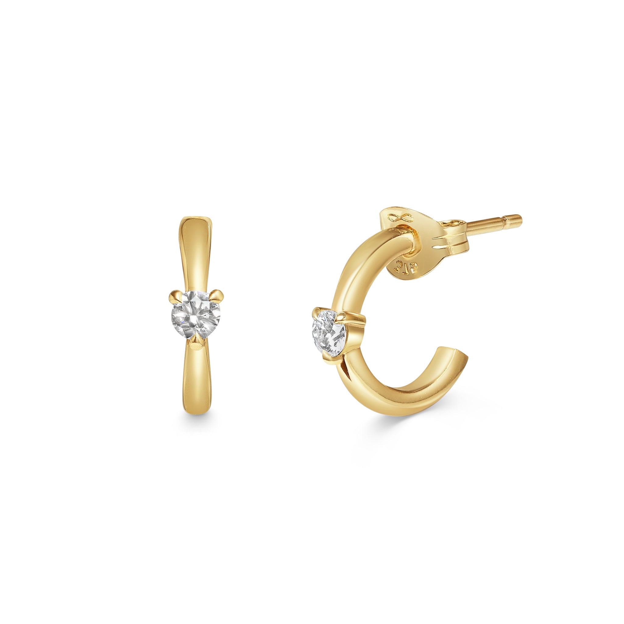 The Diamond Pinched Huggie Earrings by East London jeweller Rachel Boston | Discover our collections of unique and timeless engagement rings, wedding rings, and modern fine jewellery.