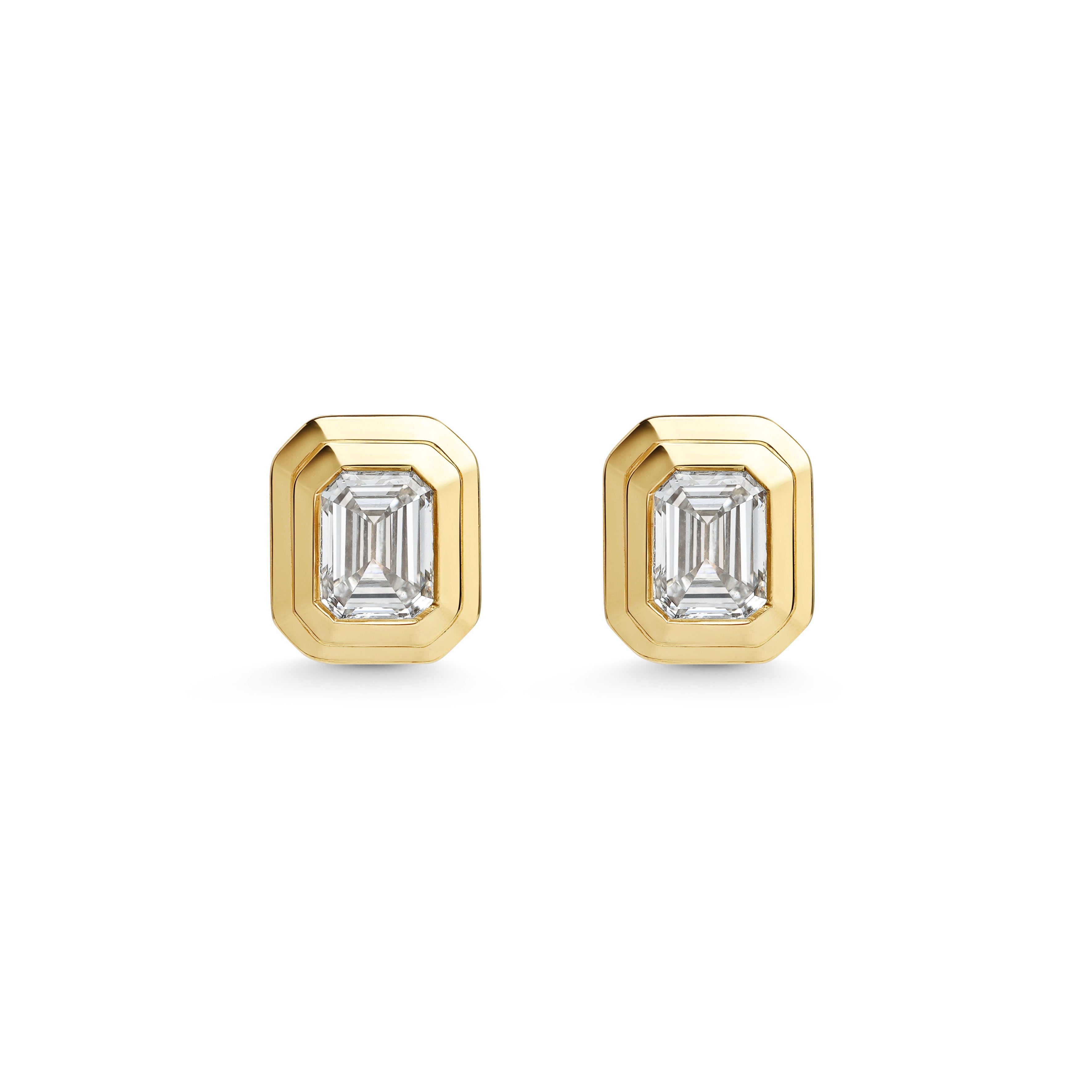 The RADIATE STUDS - EMERALD CUT by East London jeweller Rachel Boston | Discover our collections of unique and timeless engagement rings, wedding rings, and modern fine jewellery.