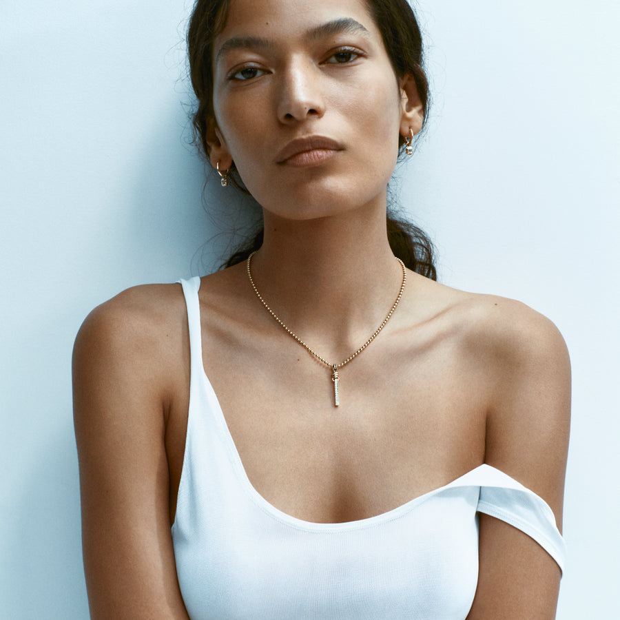 The KNIFE EDGE HOOPS WITH RADIATE DROPPERS - EMERALD CUT by East London jeweller Rachel Boston | Discover our collections of unique and timeless engagement rings, wedding rings, and modern fine jewellery. - Rachel Boston Jewellery