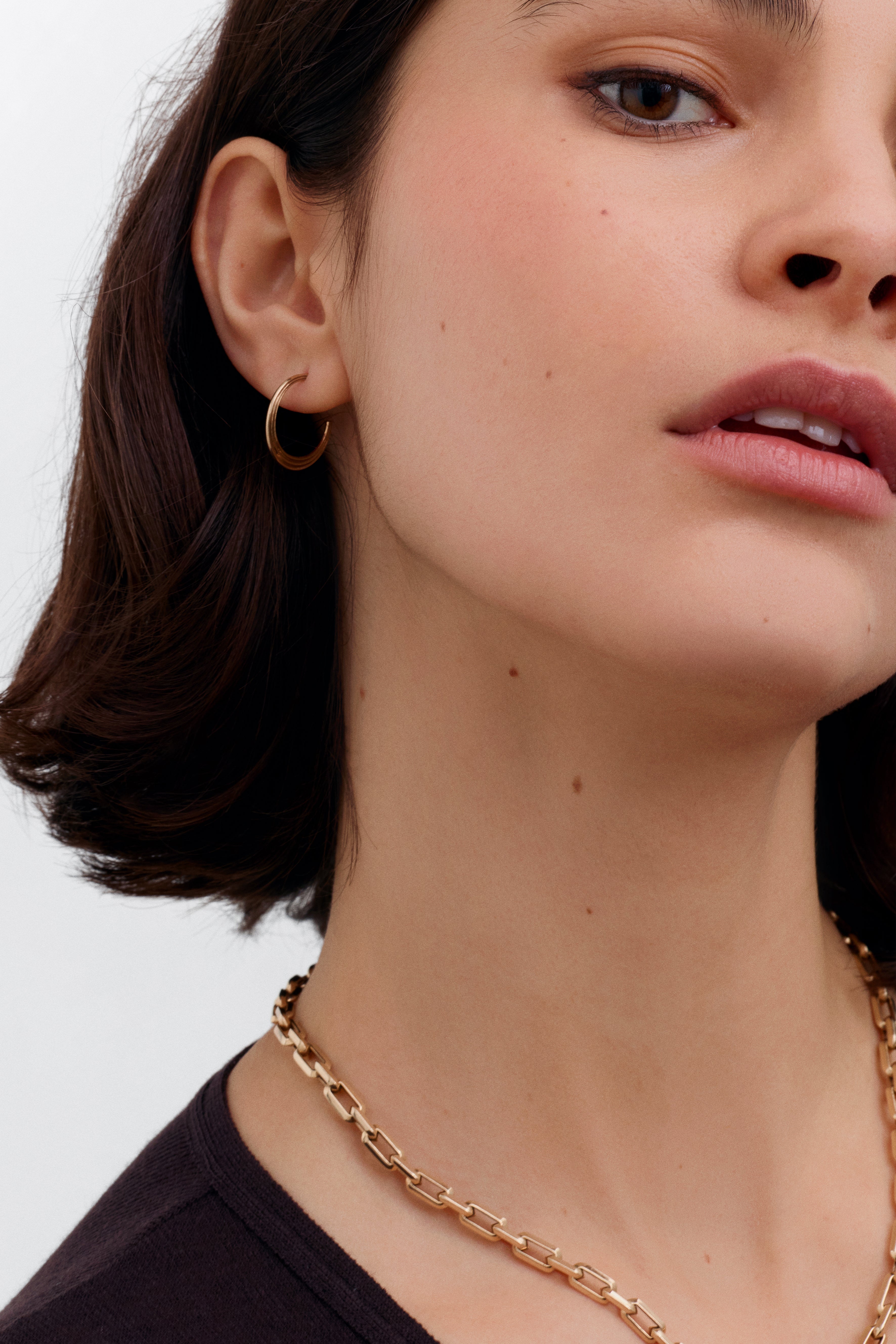 The Adversus Hoop Earrings by East London jeweller Rachel Boston | Discover our collections of unique and timeless engagement rings, wedding rings, and modern fine jewellery.