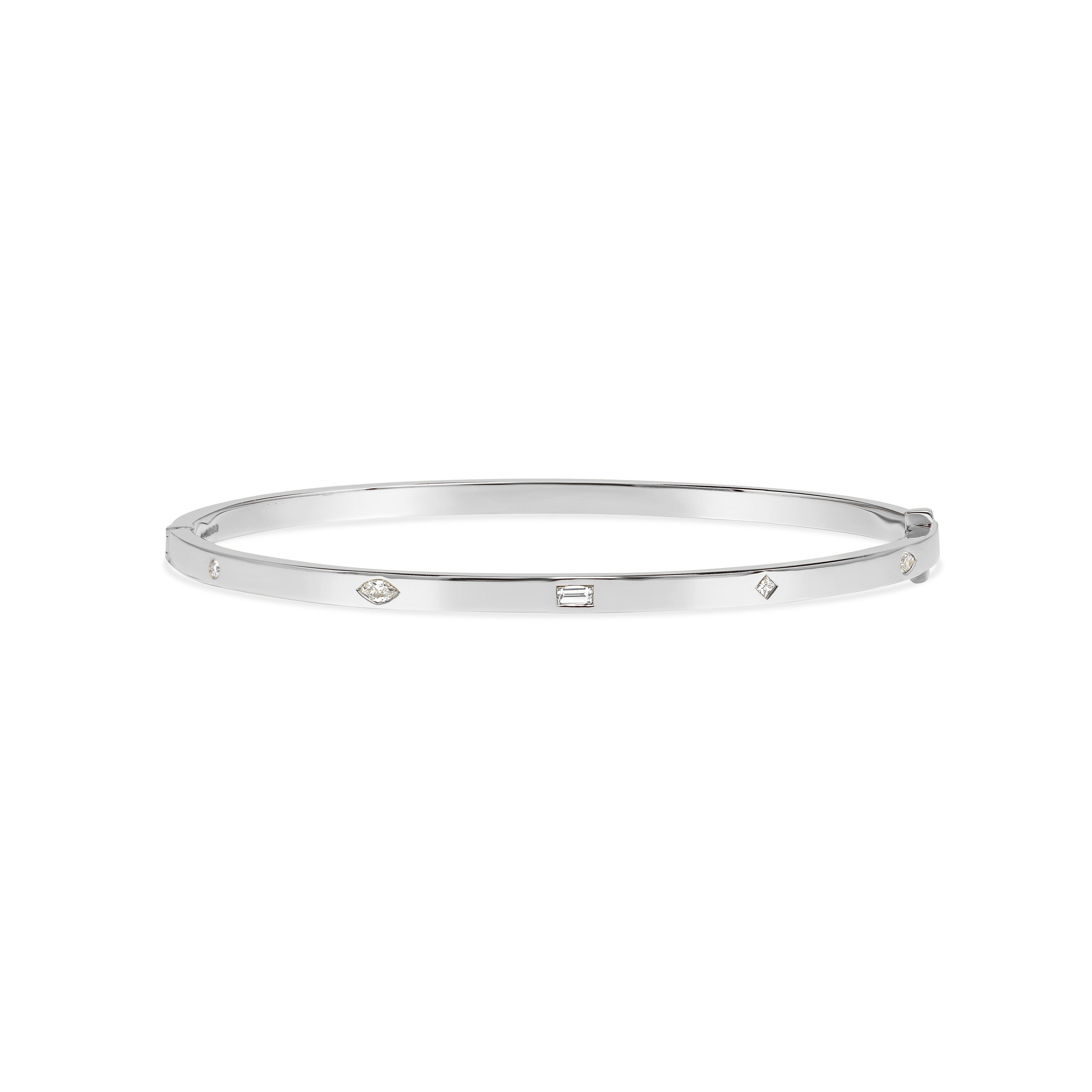 The Mixed Diamond Bangle by East London jeweller Rachel Boston | Discover our collections of unique and timeless engagement rings, wedding rings, and modern fine jewellery.