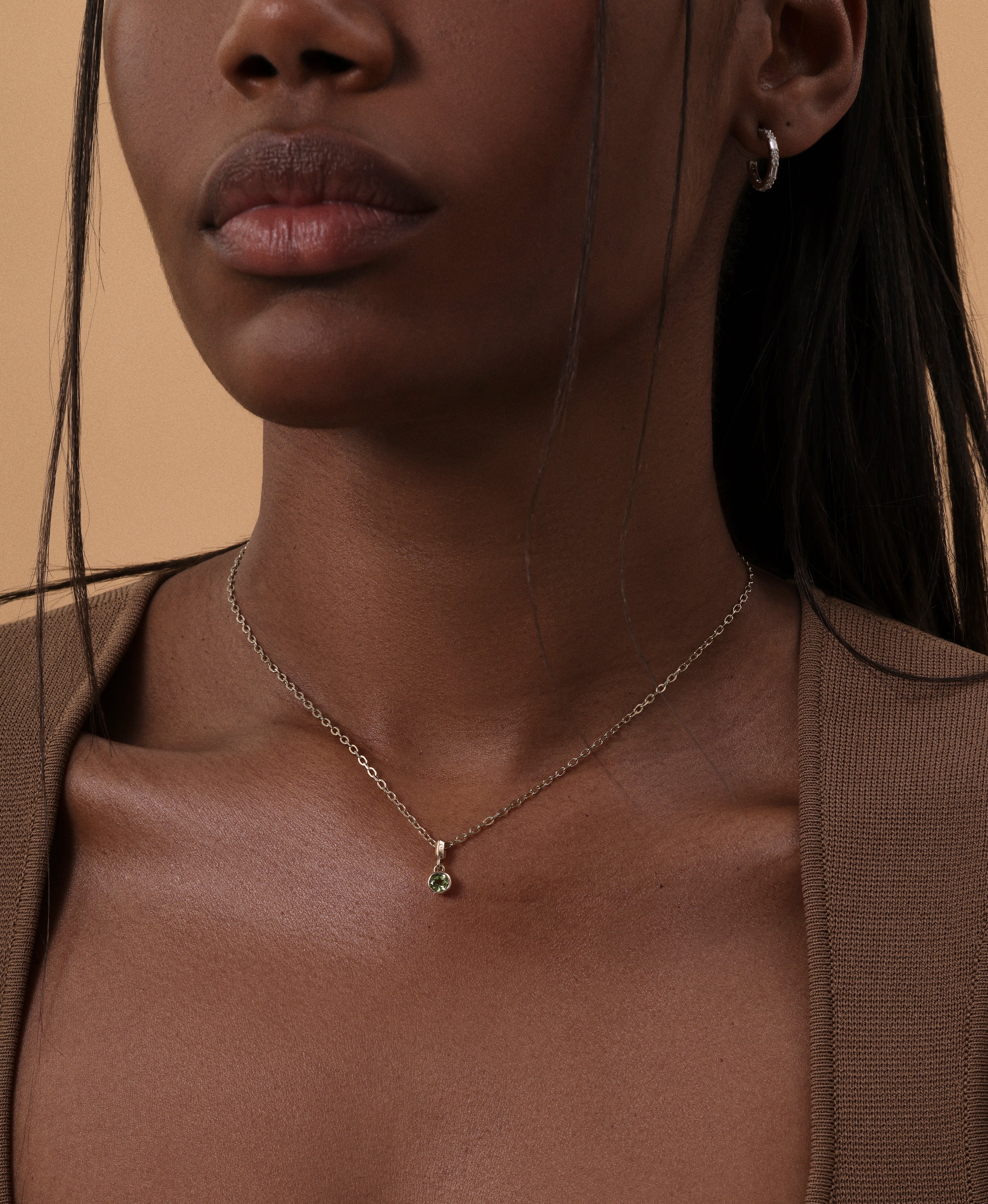 The Baguette & Round Hoop Earrings by East London jeweller Rachel Boston | Discover our collections of unique and timeless engagement rings, wedding rings, and modern fine jewellery.