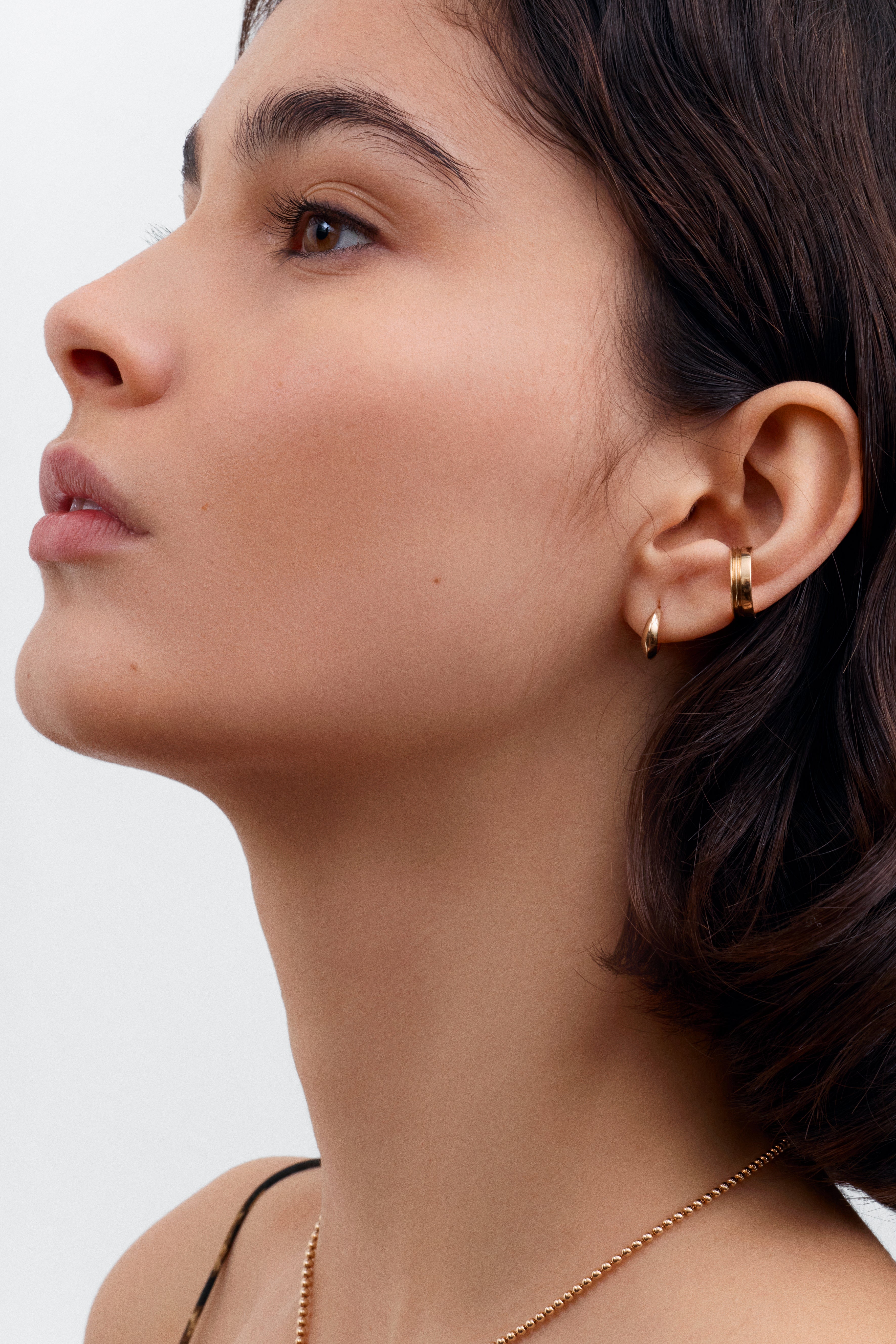 The Tapered Knife Edge Earrings by East London jeweller Rachel Boston | Discover our collections of unique and timeless engagement rings, wedding rings, and modern fine jewellery.
